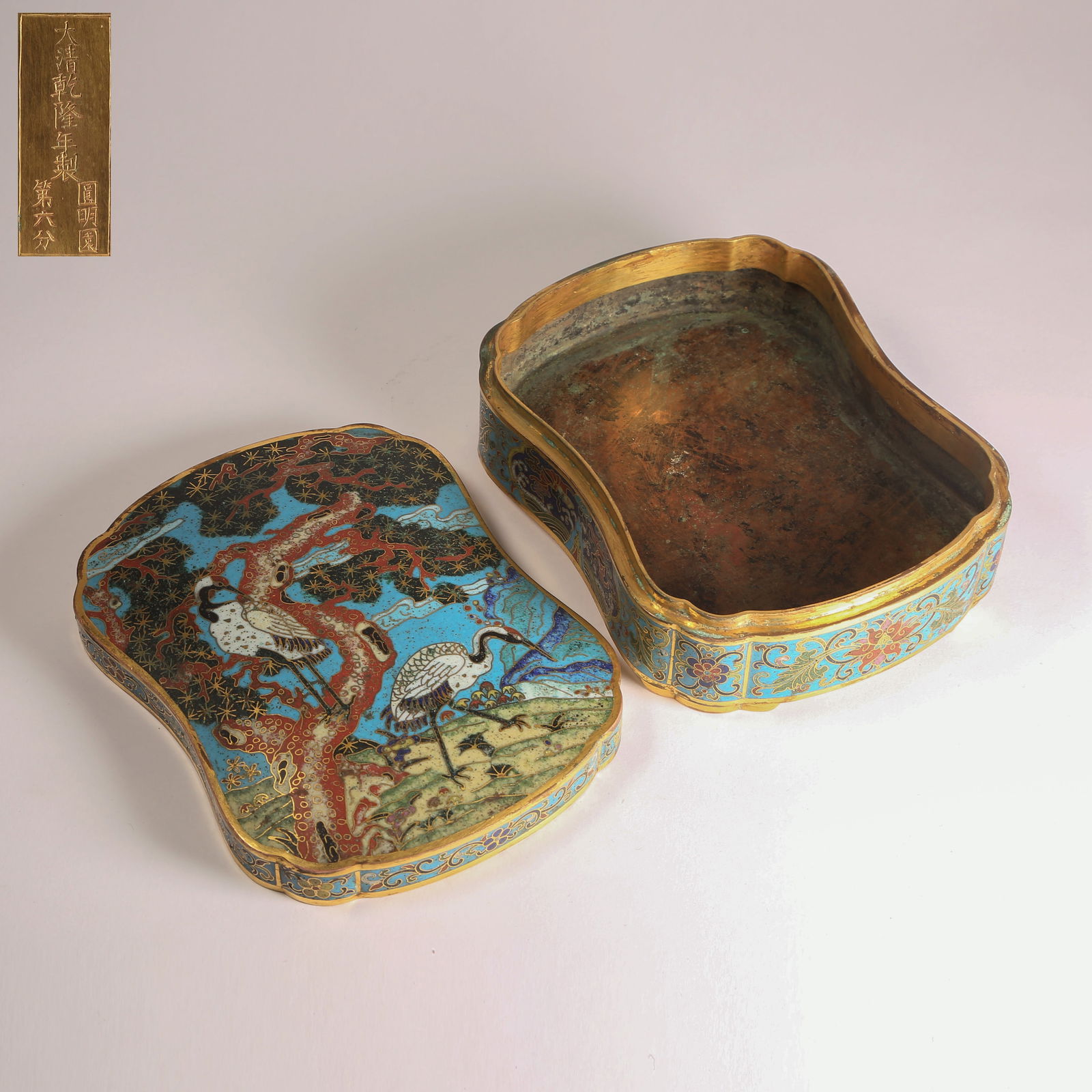 A CLOISONNÉ-ENAMEL COVERED BOX ON BRONZE WITH PINE AND CRANE LONGEVITY MOTIFS: Cloisonné-Enamel Covered Box on Bronze with Pine and Crane Longevity Motifs