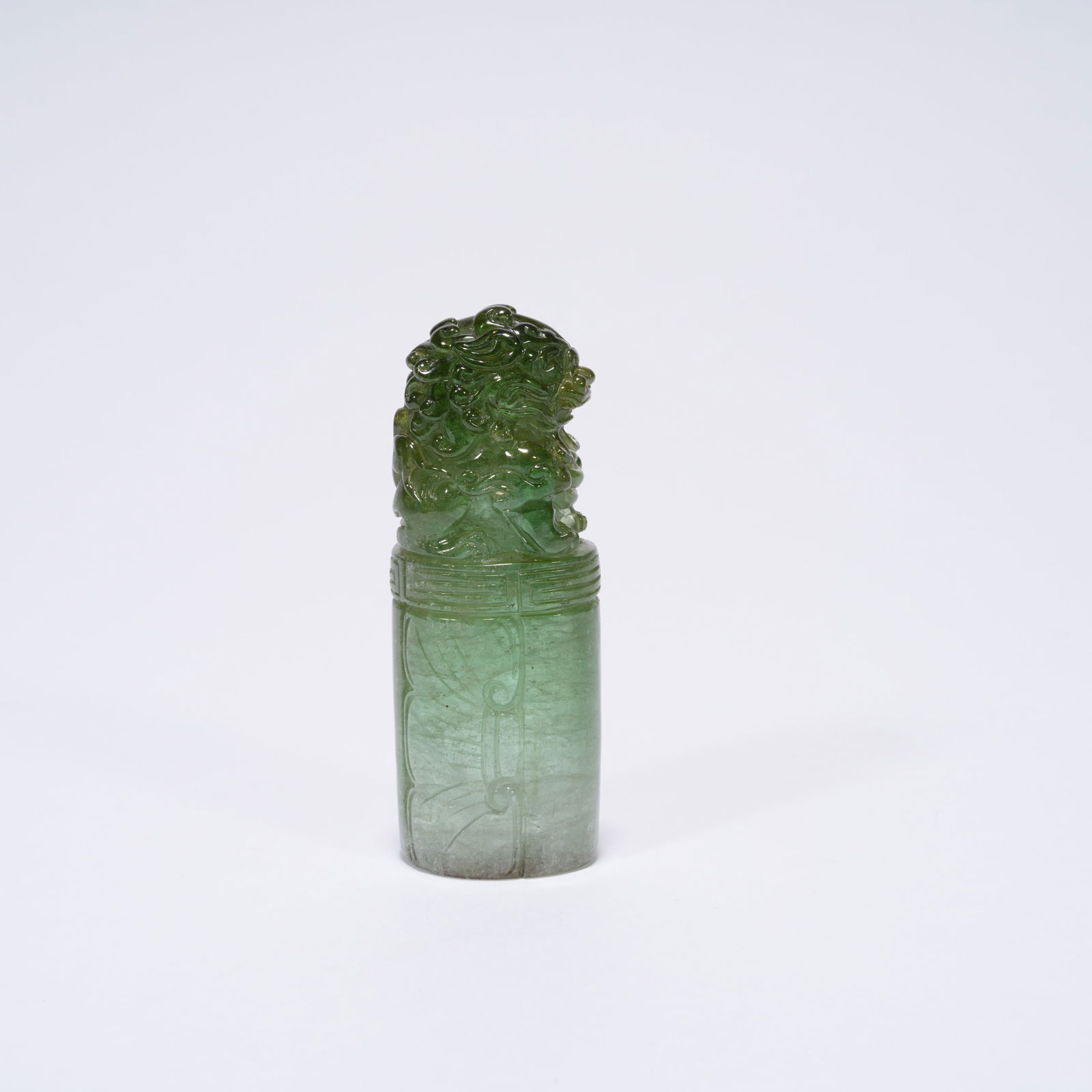 A TOURMALINE CARVED TIGER-HANDLE SEAL: Tourmaline Carved Tiger-Handle Seal