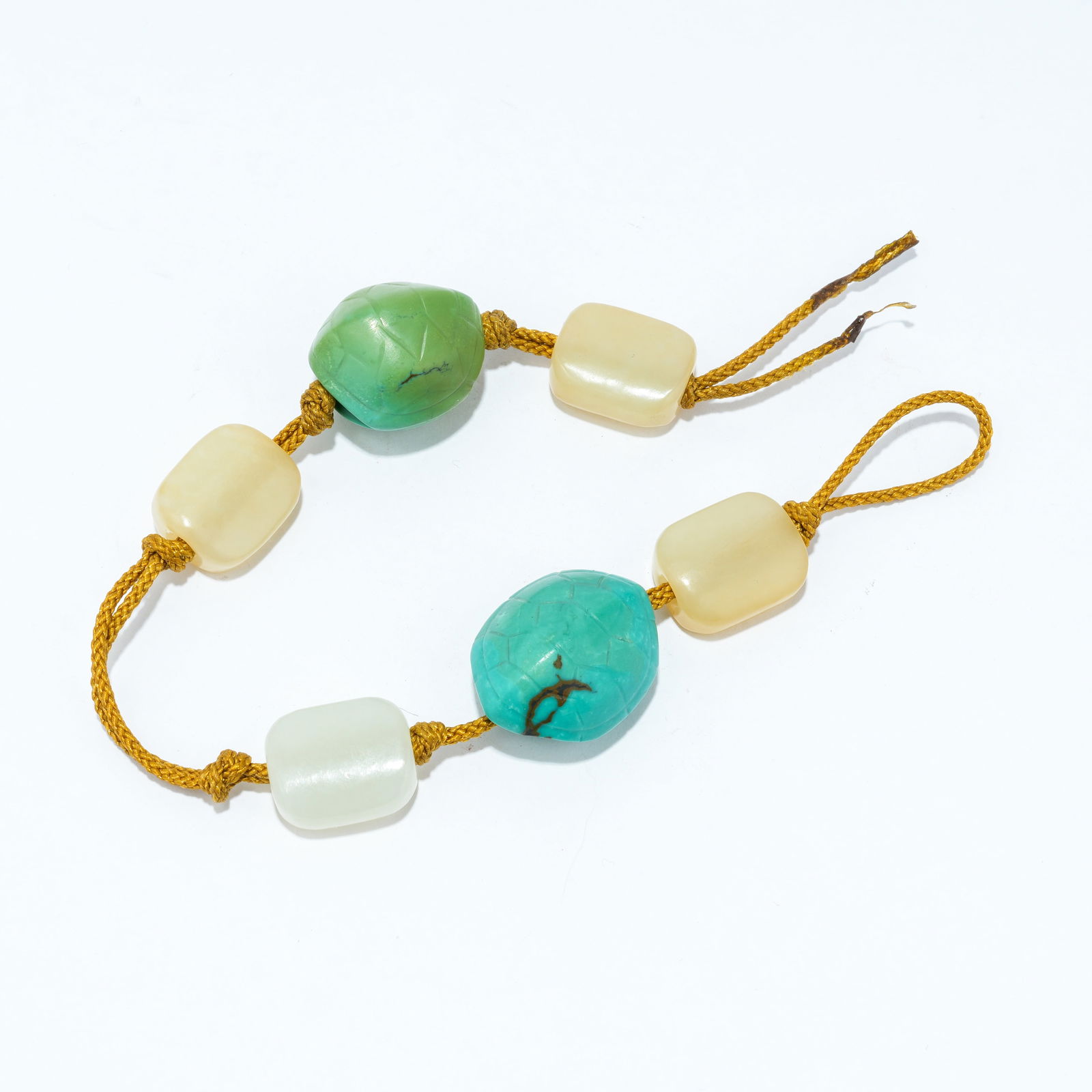 A HETIAN JADE "HUNDRED TREASURES" BEAD NECKLACE (1 of 11)