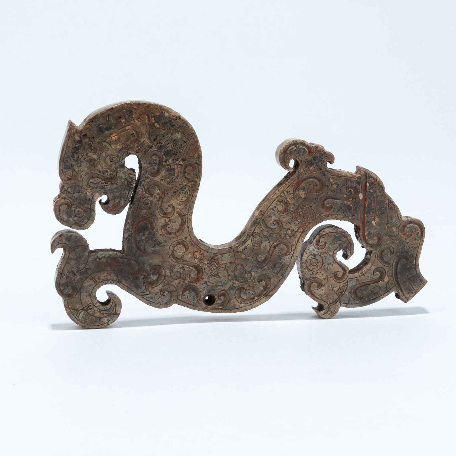 A ARCHAIC JADE DRAGON-SHAPED PENDANT: Archaic Jade Dragon-Shaped Pendant