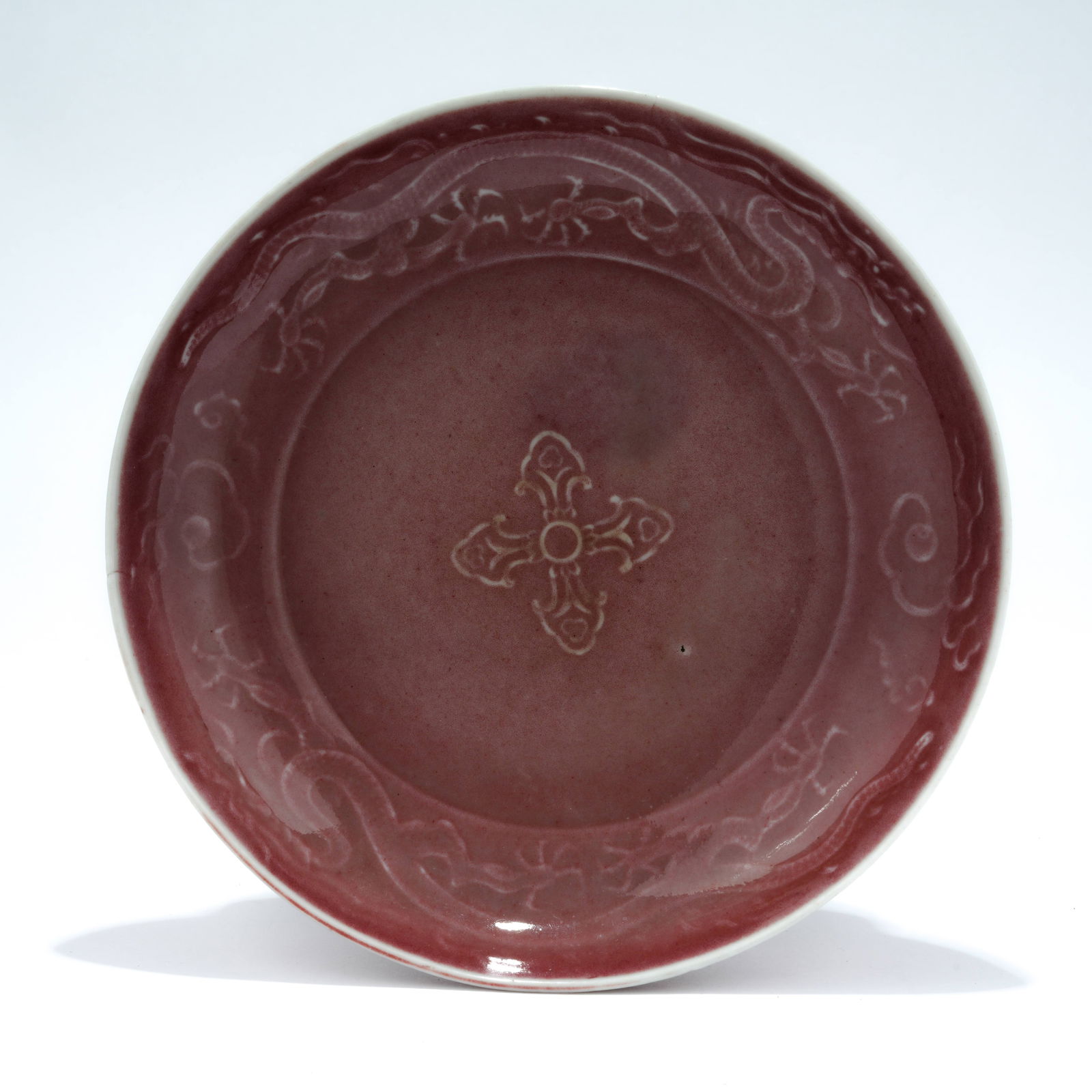 A KIDNEY-BEAN RED GLAZED DISH WITH INCISED DRAGON DESIGN (1 of 9)