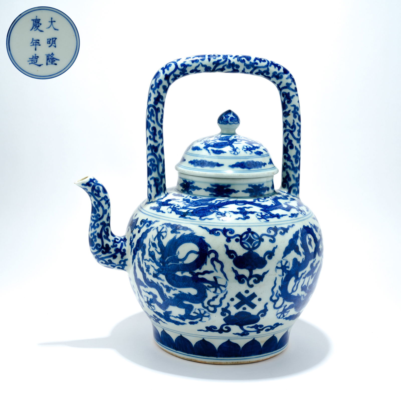 A BLUE-AND-WHITE DRAGON-DECORATED BAIL-HANDLE EWER: Blue-and-White Dragon-Decorated Bail-Handle Ewer