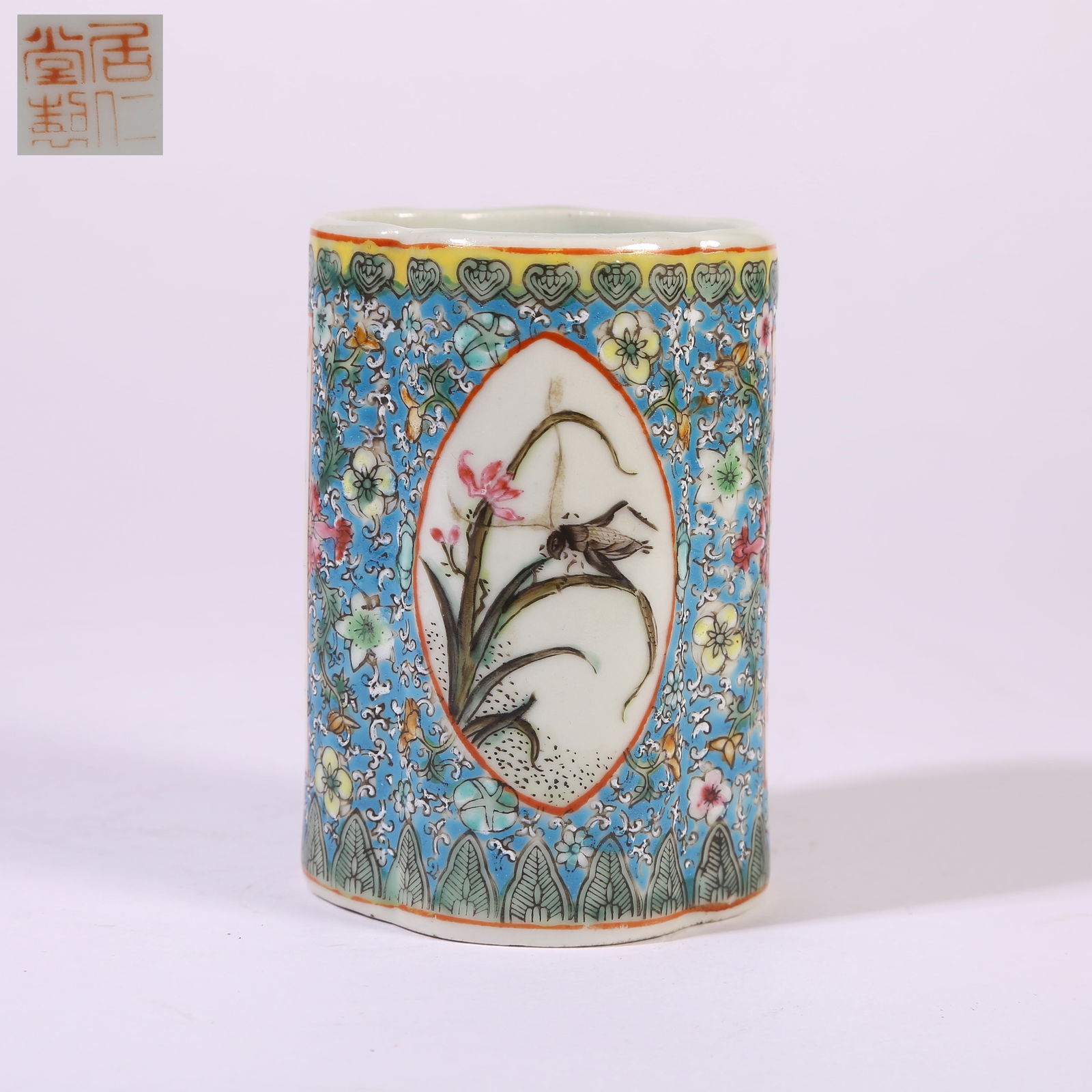 A BLUE-GROUND FAMILLE-ROSE PANELLED BRUSH POT WITH CORDYCEPS MOTIFS: Blue-Ground Famille-Rose Panelled Brush Pot with Cordyceps Motifs