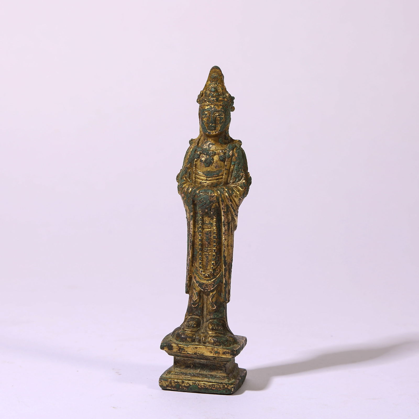 A GILT-BRONZE STANDING FIGURE OF GUANYIN: Gilt-Bronze Standing Figure of Guanyin