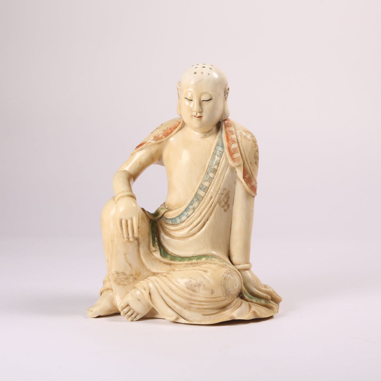 A POLYCHROME SHOUSHAN STONE SEATED ARHAT: Polychrome Shoushan Stone Seated Arhat
