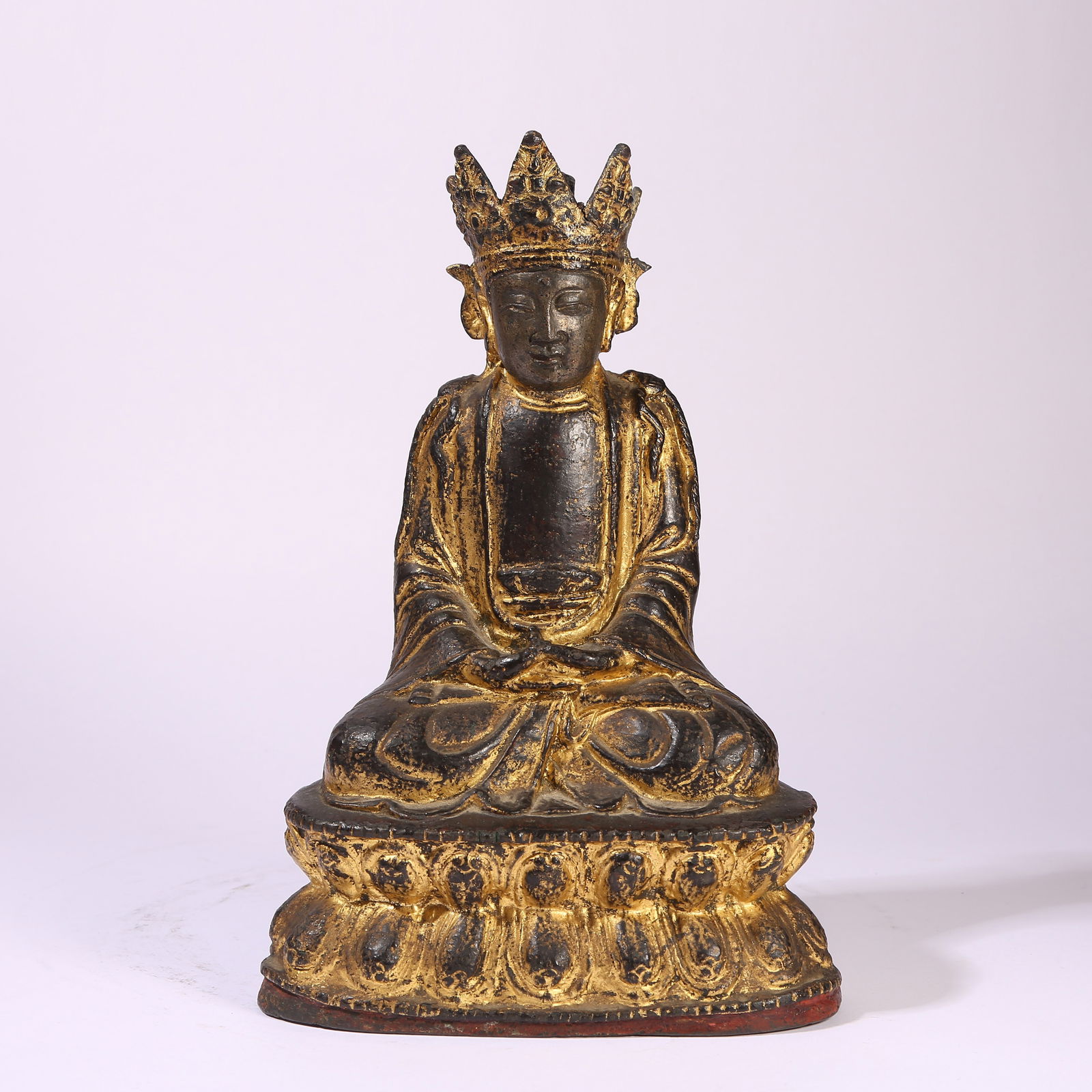A GILT-BRONZE FIGURE OF VAIROCANA BUDDHA: Gilt-Bronze Figure of Vairocana Buddha