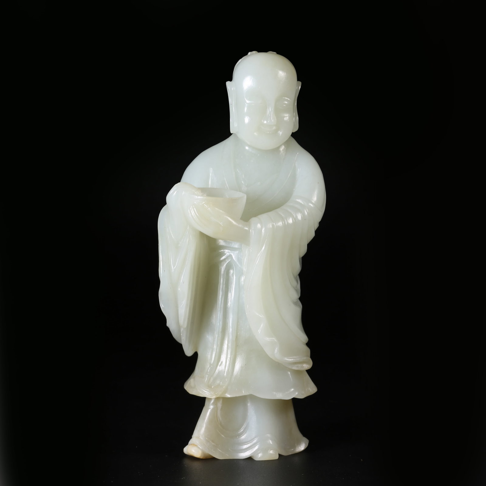 A QING DYNASTY HETIAN WHITE JADE STANDING SCHOLAR STATUE (1 of 9)
