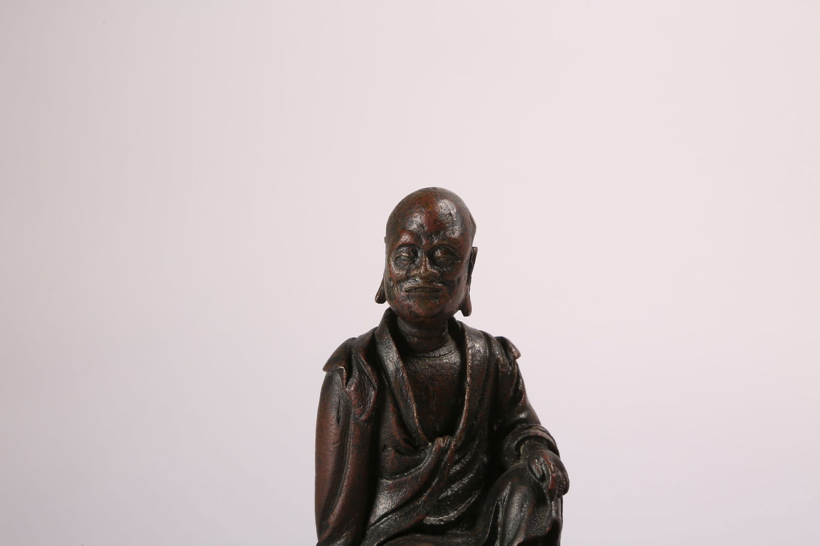 A BRONZE SEATED ARHAT - 6
