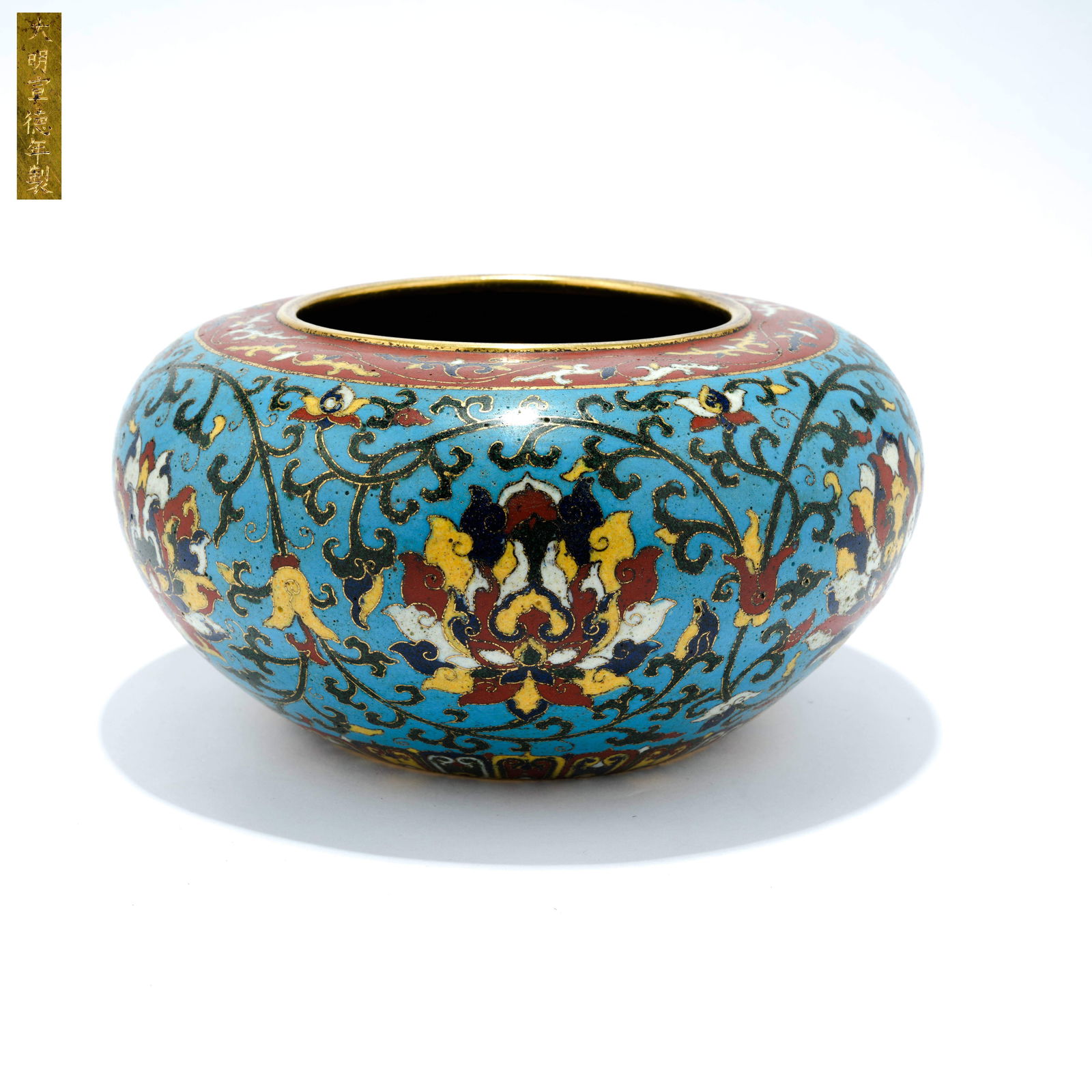 A CLOISONNÉ ENAMEL JAR WITH INTERTWINED FLORAL SCROLL DESIGN ON A BRONZE BODY (1 of 9)