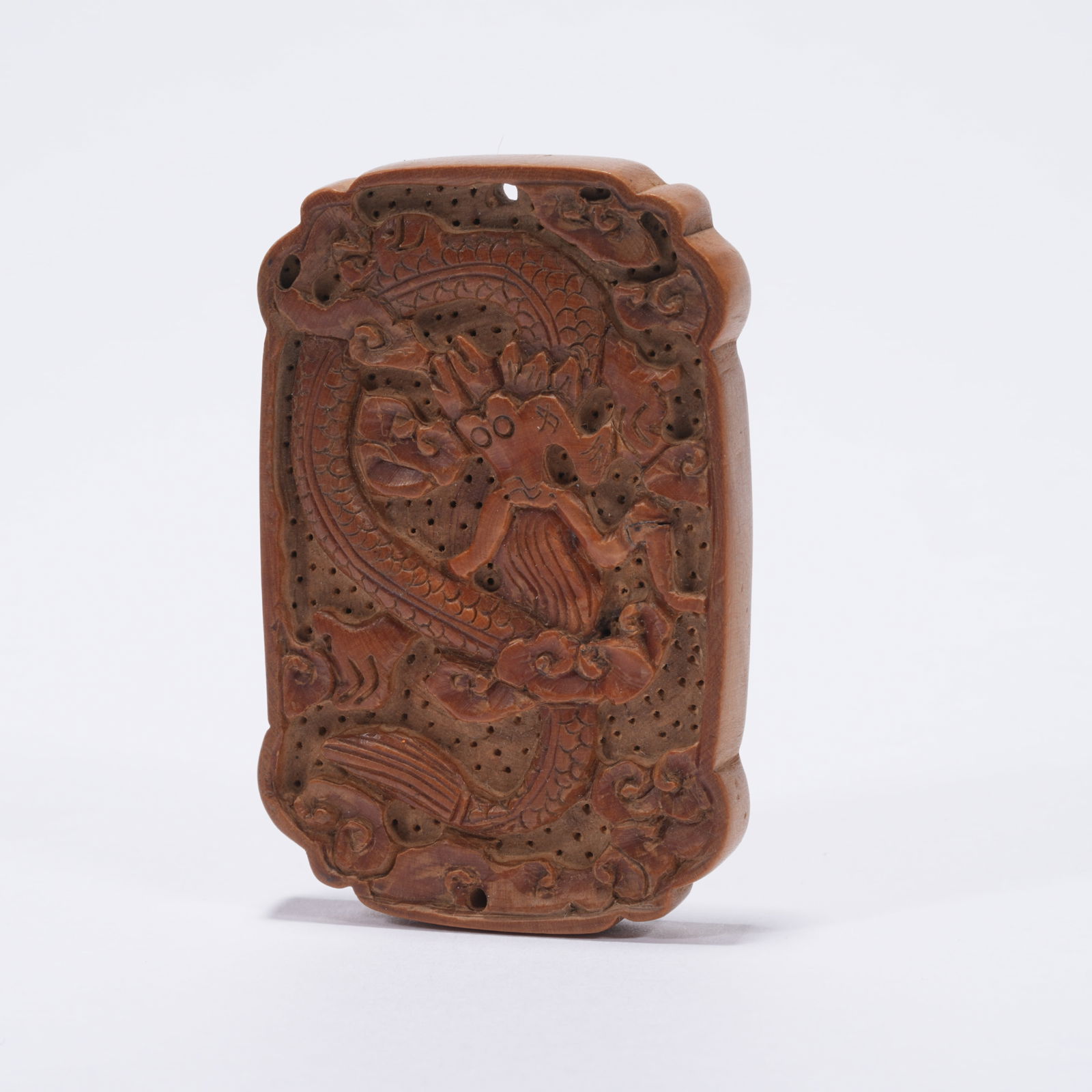 A BOXWOOD CARVED DRAGON MOTIF PLAQUE: Boxwood Carved Dragon Motif Plaque