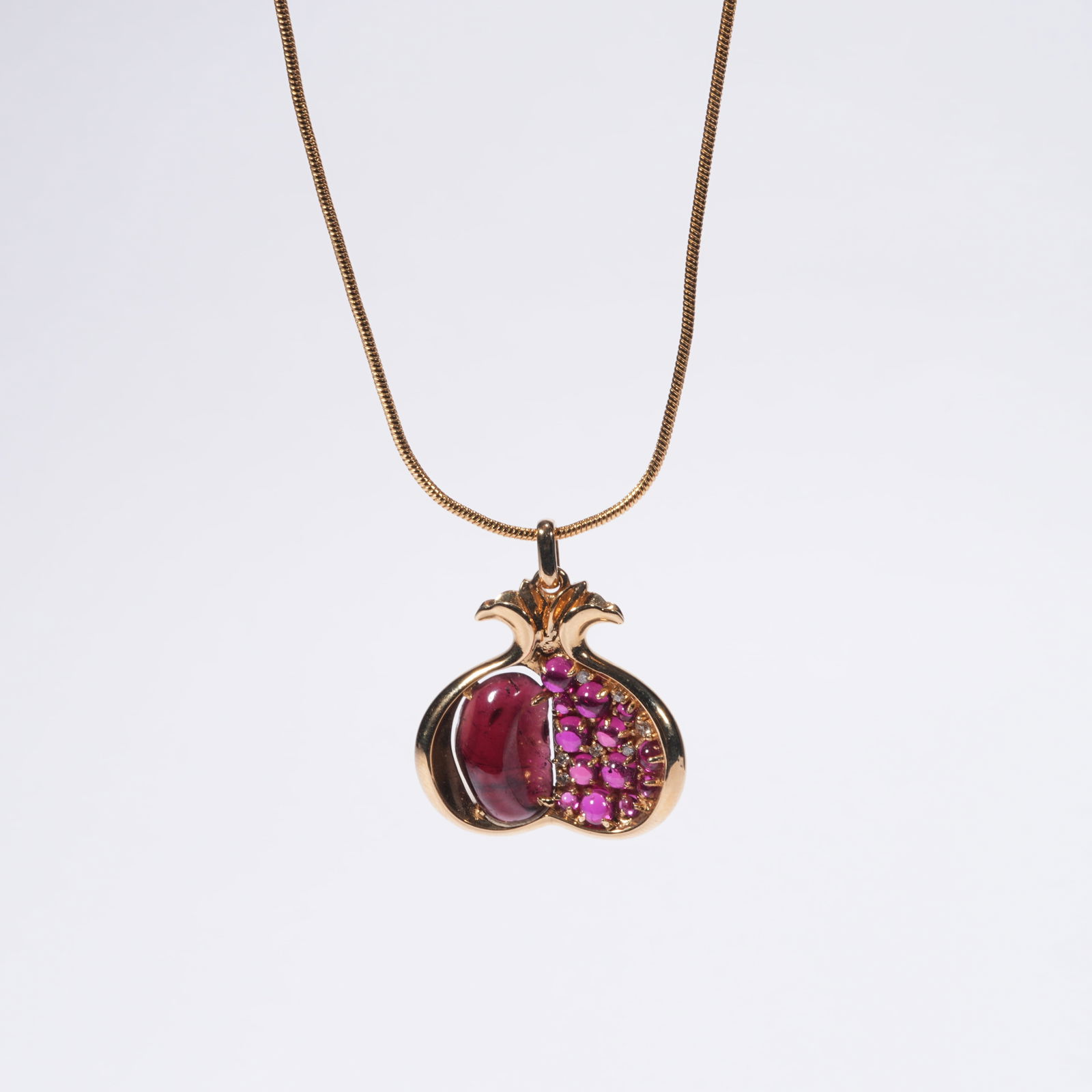 A TOURMALINE AND DIAMOND-SET NECKLACE: One Tourmaline and Diamond-Set Necklace
