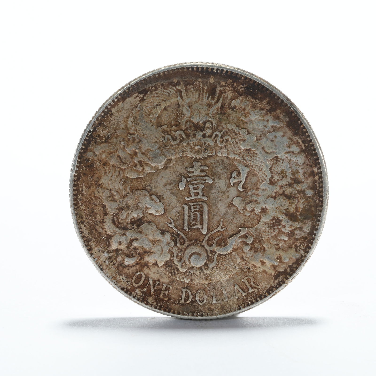 A SILVER DOLLAR COIN - 3