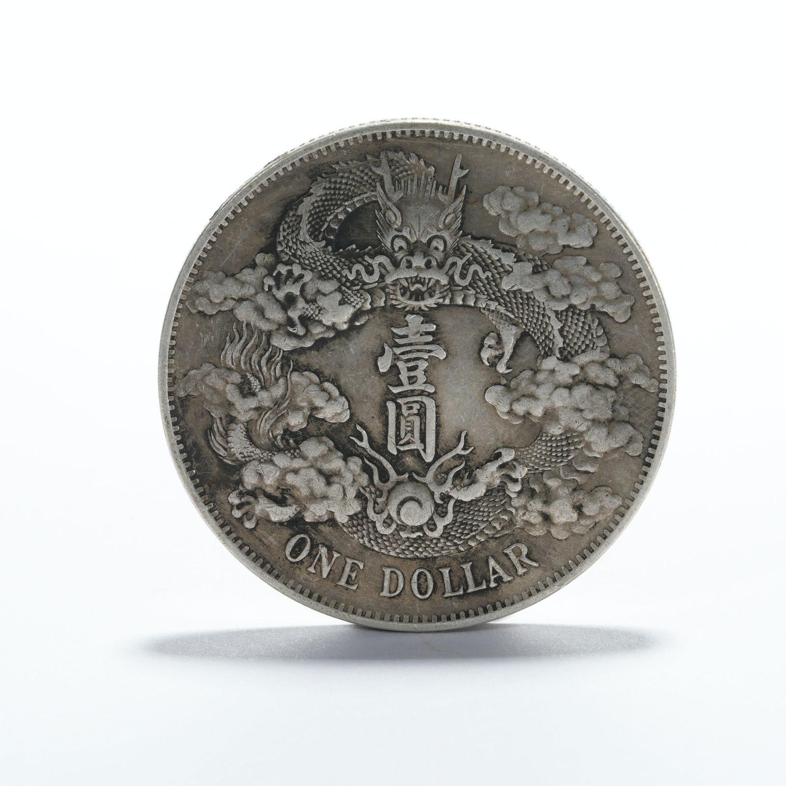 A SILVER DOLLAR COIN - 3