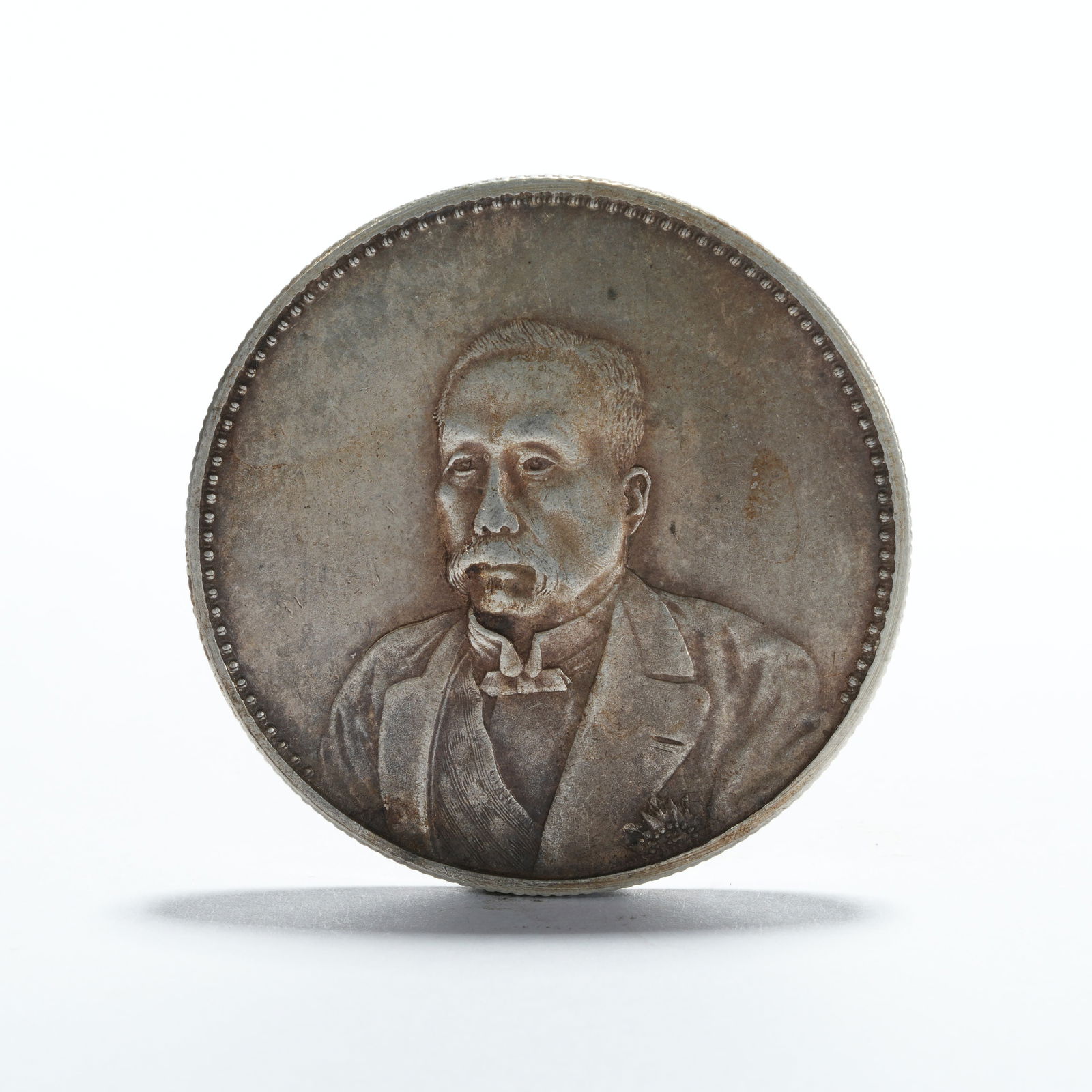 A SILVER DOLLAR COIN - 3