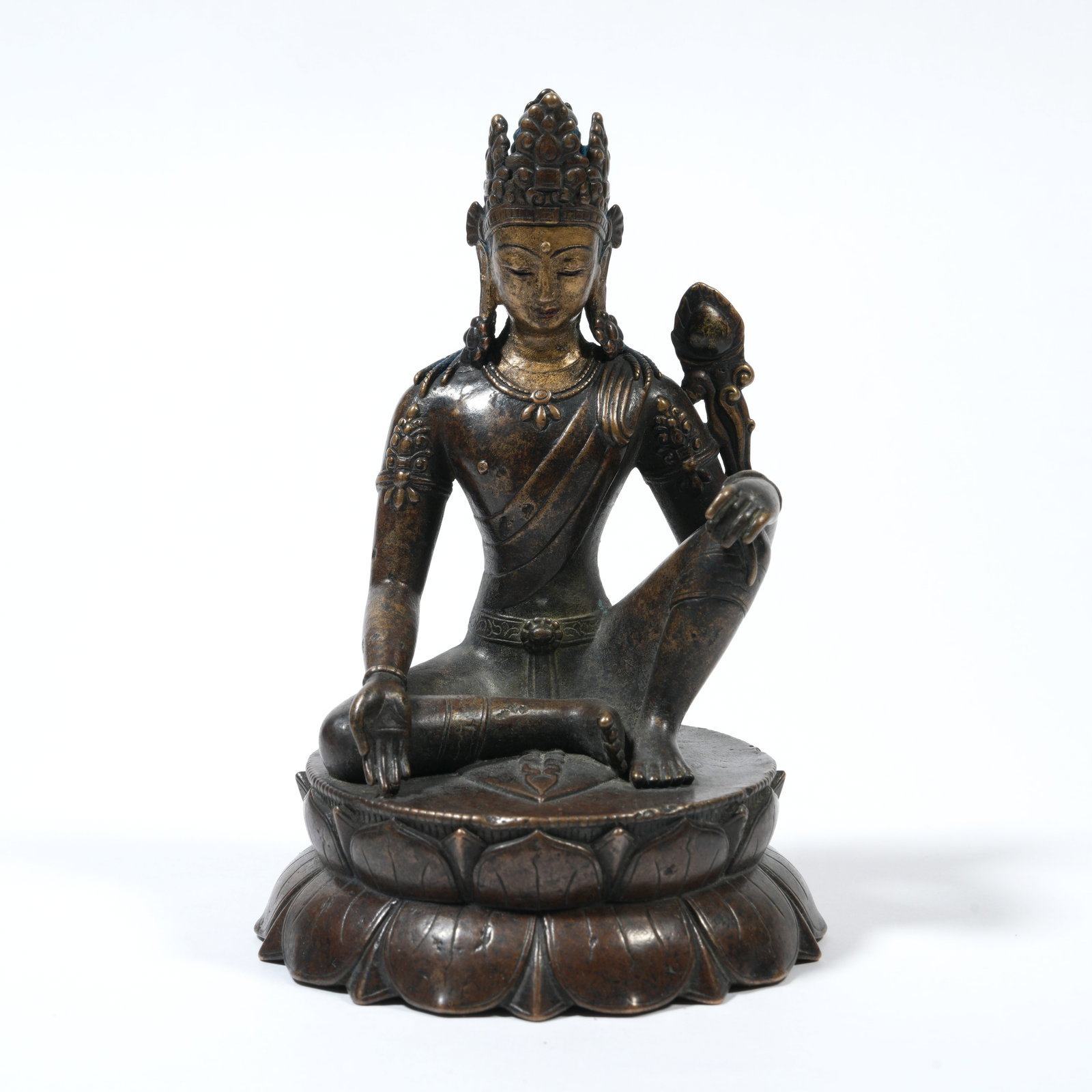 A BRONZE FIGURE OF GUANYIN IN ROYAL EASE (ZIZAI GUANYIN): Bronze Figure of Guanyin in Royal Ease (Zizai Guanyin)