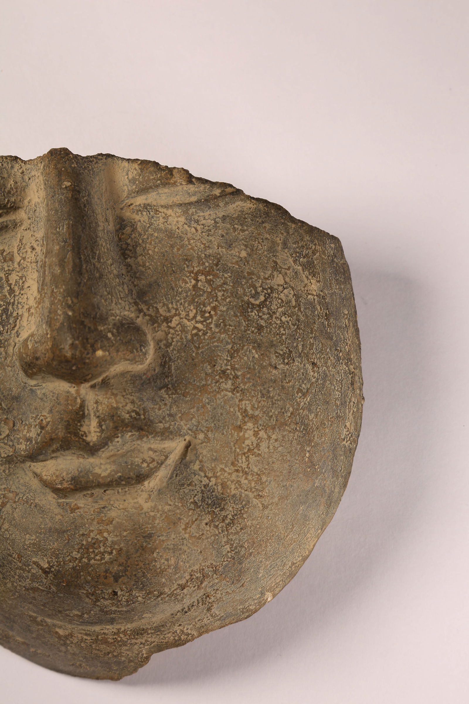 A BLUESTONE BUDDHIST FACE - 4