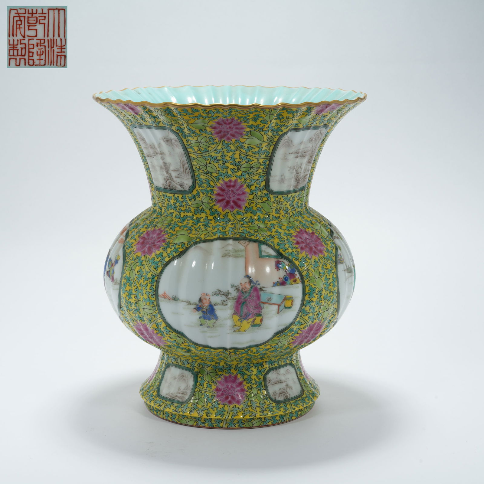 A YELLOW-GROUND FAMILLE ROSE FLOWER GU WITH LANDSCAPE AND FIGURE MOTIF: Yellow-Ground Famille Rose Flower Gu with Landscape and Figure Motif