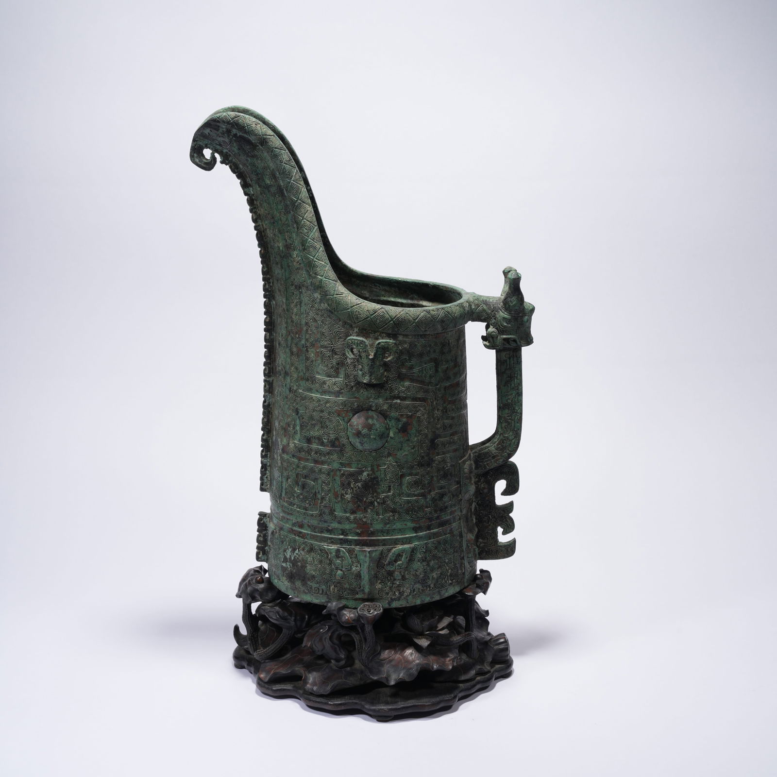 A BRONZE GUANG WINE VESSEL WITH TAOTIE MASK MOTIF (1 of 11)