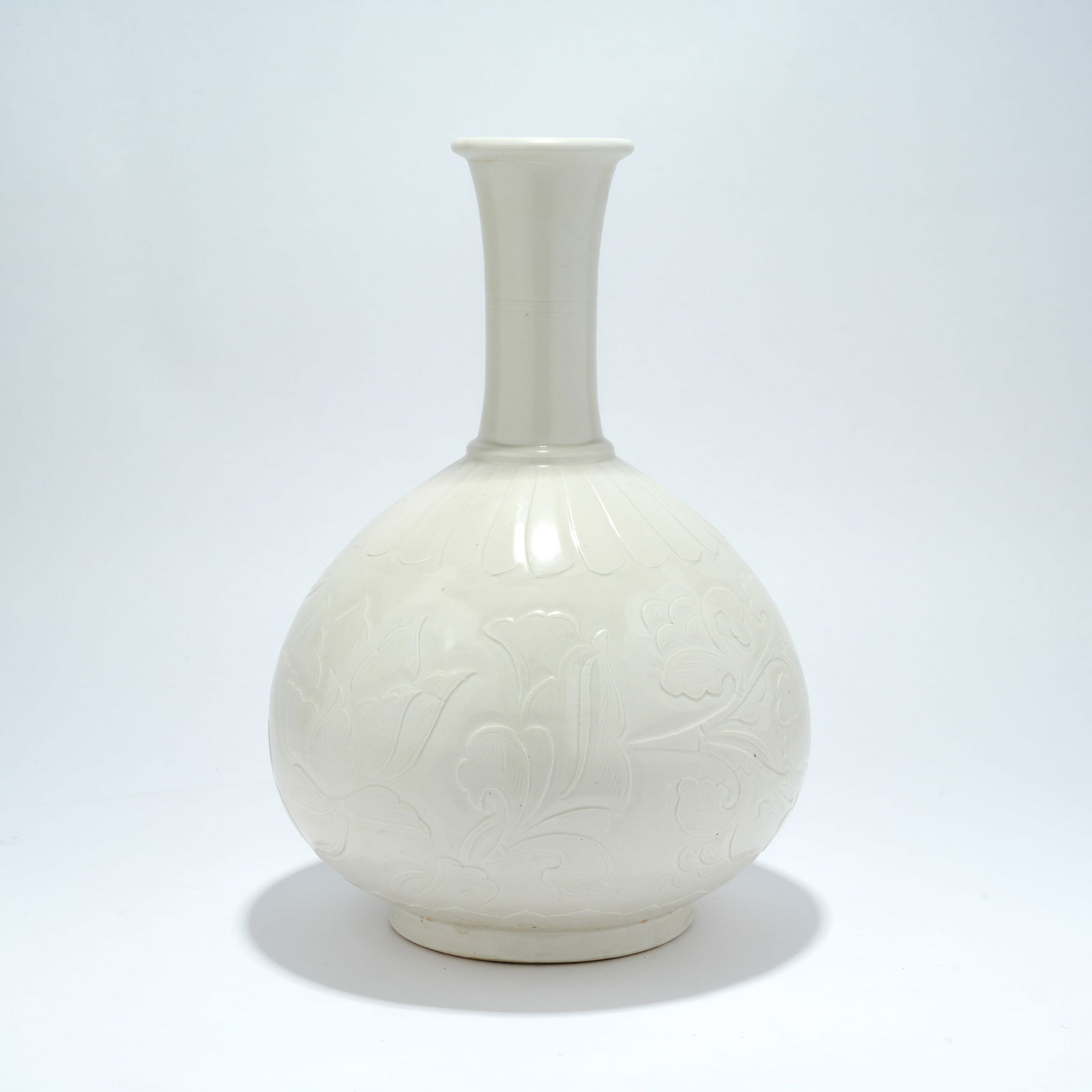 A DING WARE BOTTLE WITH INCISED AND CARVED DECORATION: Ding Ware Bottle with Incised and Carved Decoration