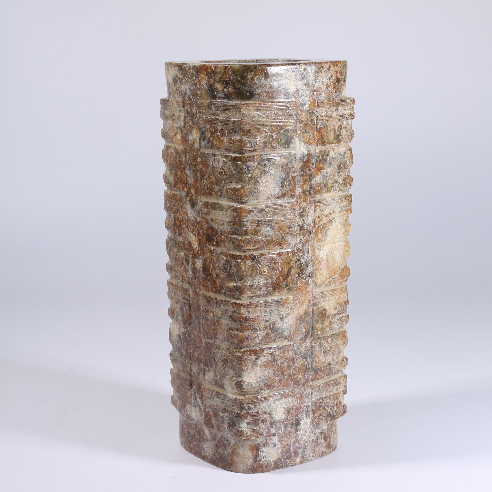 A ARCHAIC JADE CONG WITH DEITY FACE MOTIF: Archaic Jade Cong with Deity Face Motif