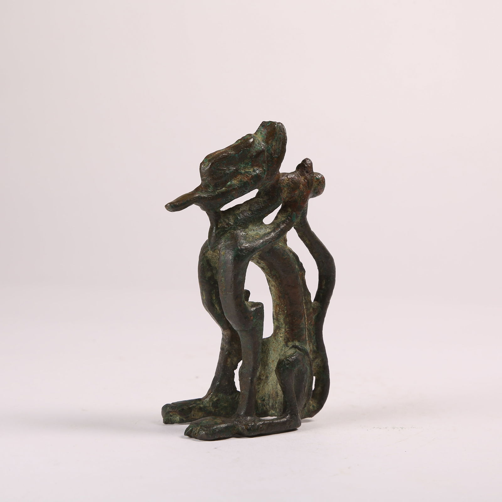 A BRONZE SEATED DRAGON FIGURINE (1 of 8)