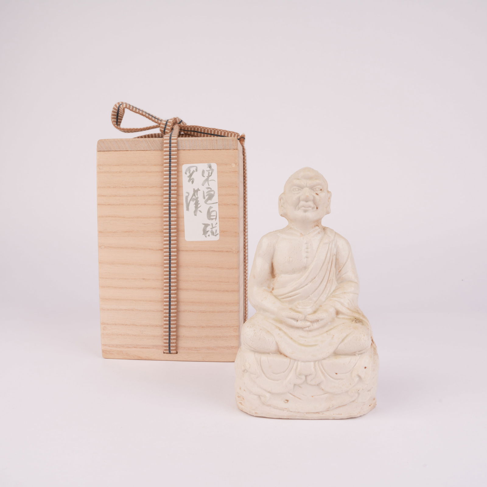 A ARHAT FIGURE, DING KILN, SONG DYNASTY: Arhat Figure, Ding Kiln, Song Dynasty