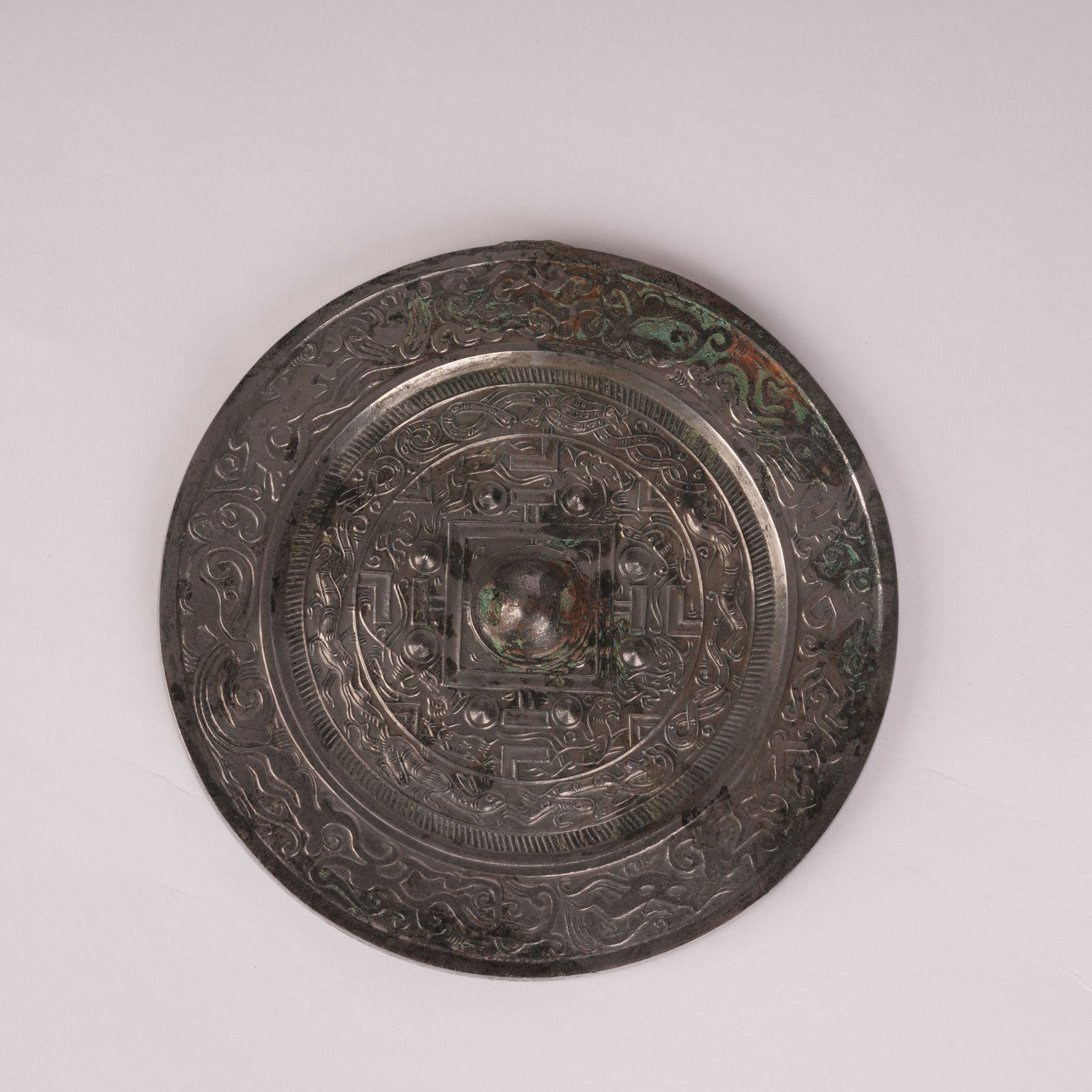 A CIRCULAR BRONZE MIRROR WITH STANDARD PATTERN, HAN DYNASTY (1 of 8)