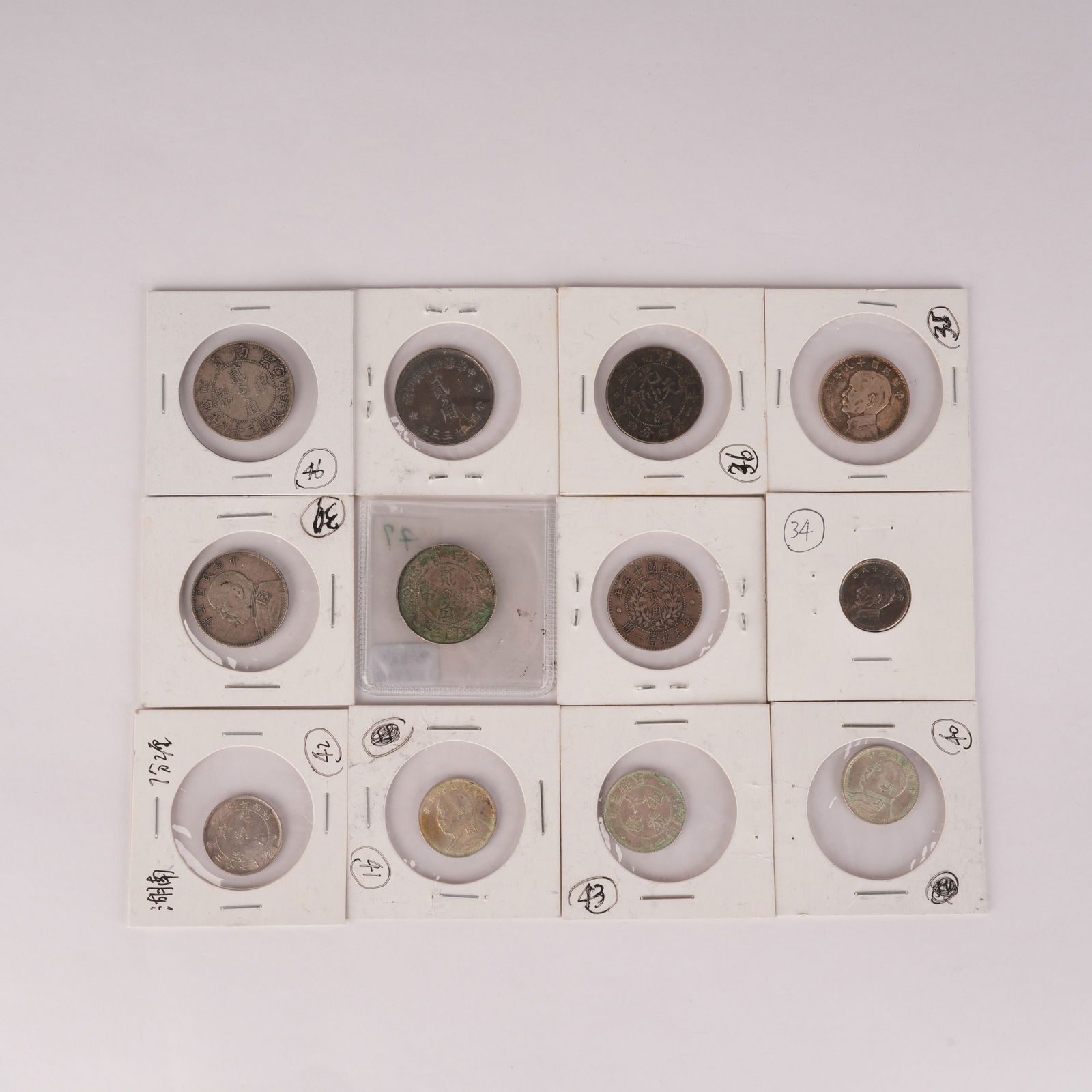 A SET OF TWELVE SILVER COINS (1 of 8)