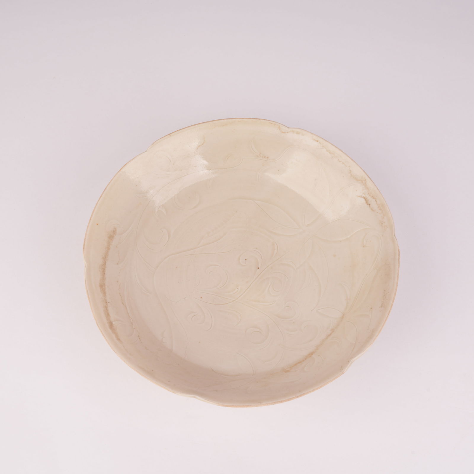 A FLOWER-PATTERNED DING KILN PLATE, SONG DYNASTY (1 of 7)