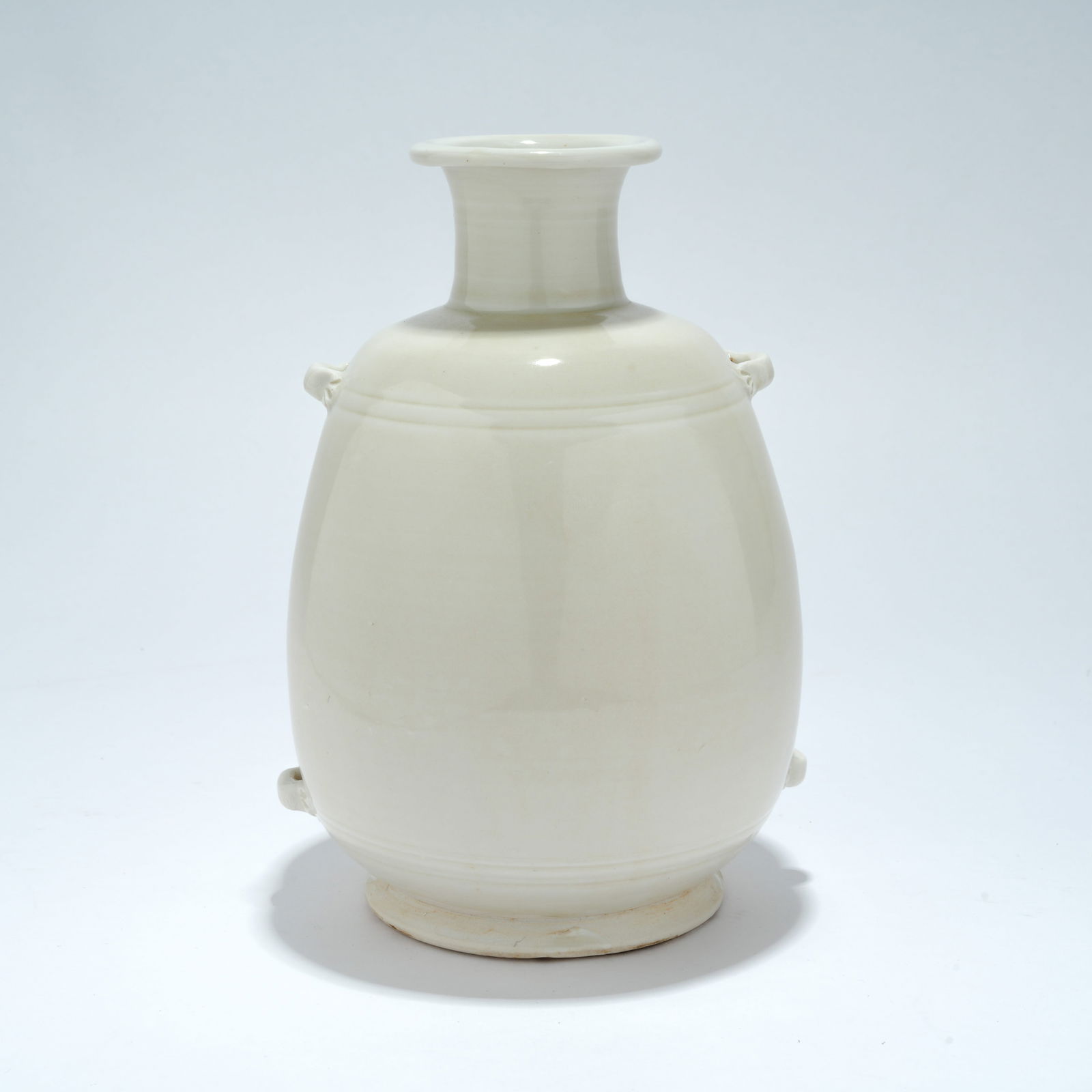 A DING WARE BOTTLE VASE WITH PIERCED LUG HANDLES: Ding Ware Bottle Vase with Pierced Lug Handles