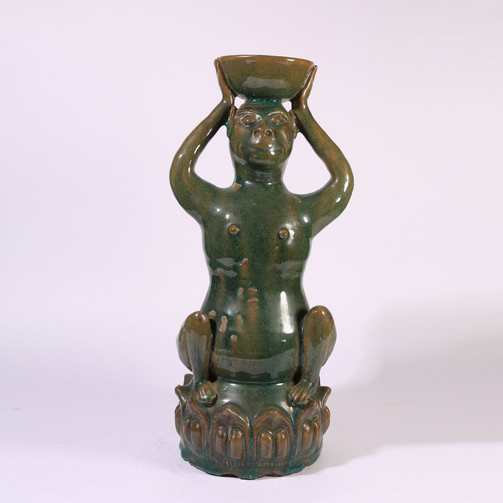 A GREEN-GLAZED "SPIRIT MONKEY PRESENTING LONGEVITY" OIL LAMP: Green-Glazed "Spirit Monkey Presenting Longevity" Oil Lamp