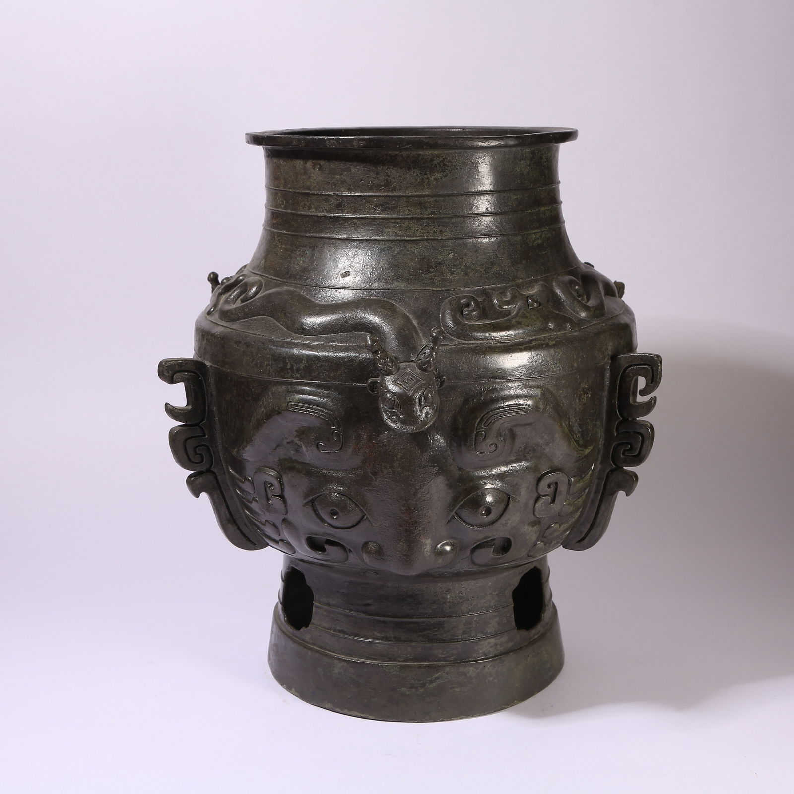 A BRONZE JAR WITH BEAST-HEAD AND HALBERD MOTIFS: Bronze Jar with Beast-Head and Halberd Motifs