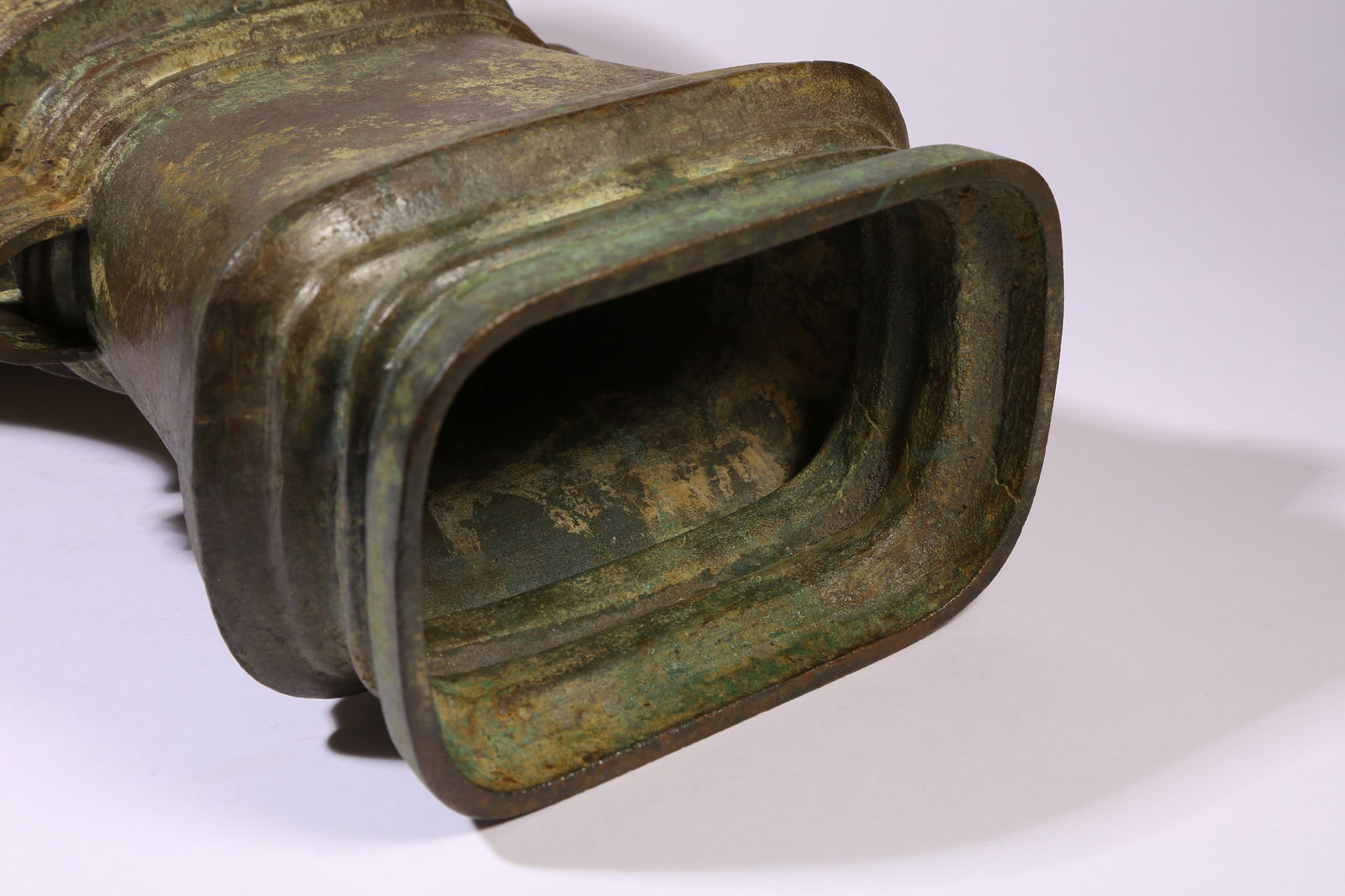 A BRONZE FLAT-HANDLED HU - 9