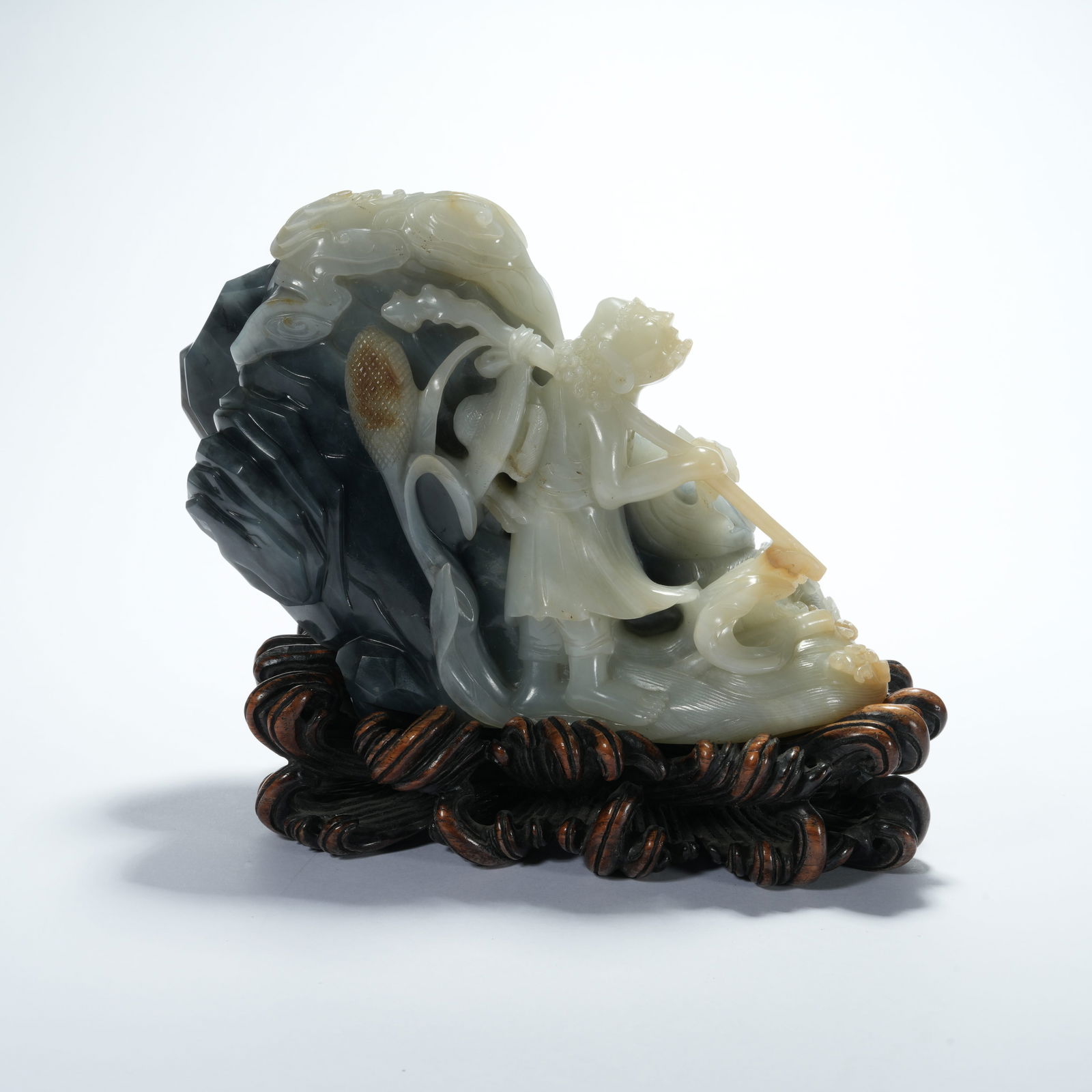 A HETIAN JADE CARVED HUMAN MOUNTAIN-FORM ORNAMENT: Hetian Jade Carved Human Mountain-Form Ornament
