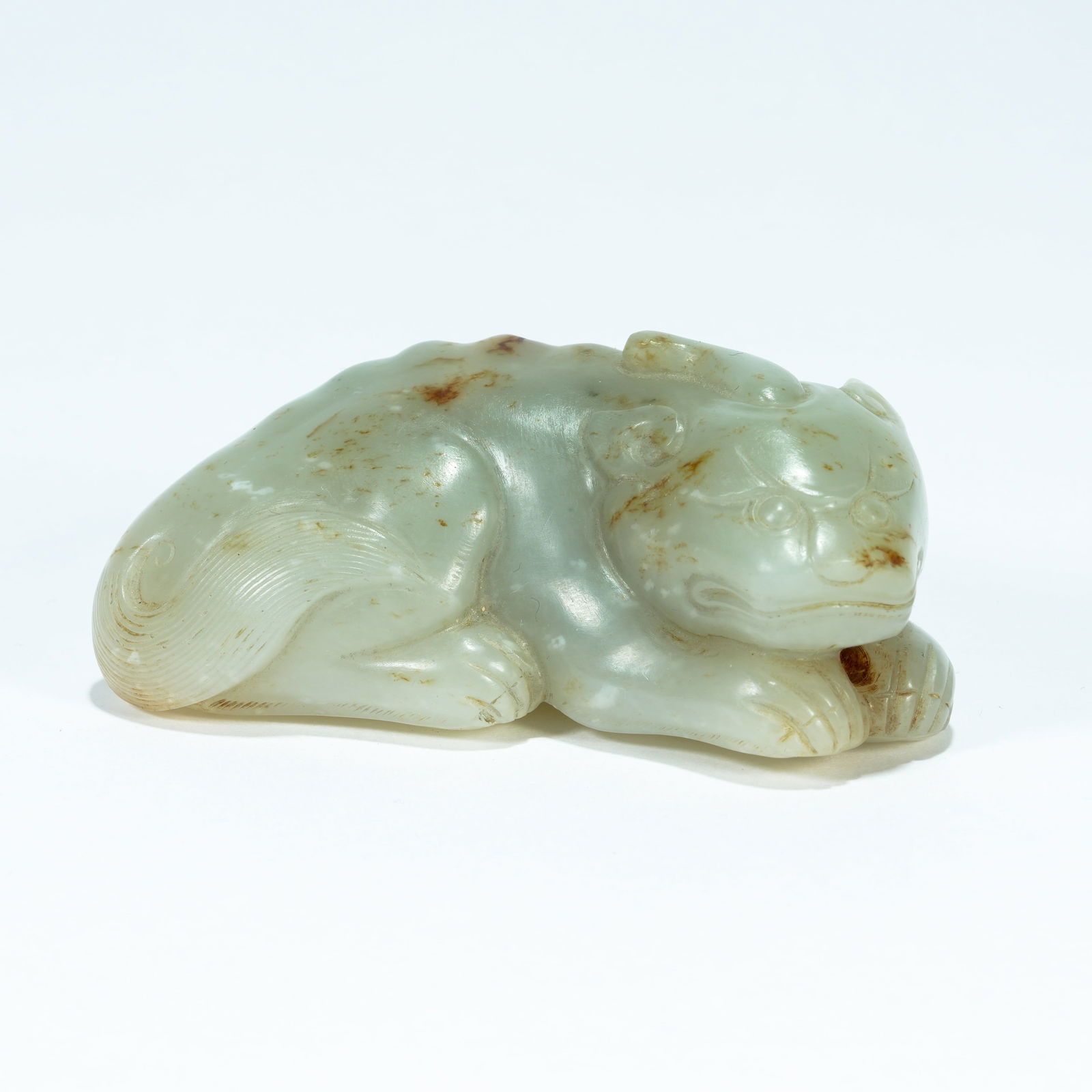 A HETIAN JADE CARVED RECUMBENT TIGER ORNAMENT (1 of 9)