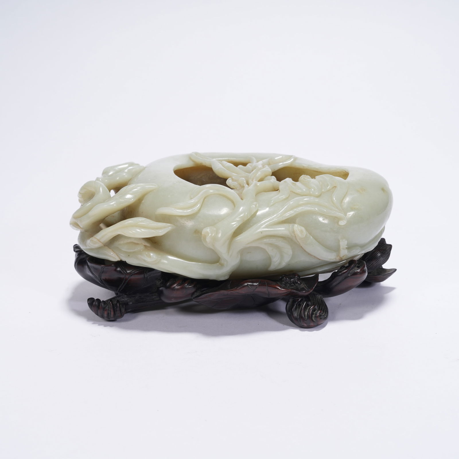 A HETIAN JADE XI WASHER CARVED WITH LONGEVITY PEACHES AND AUSPICIOUS MOTIFS (1 of 10)