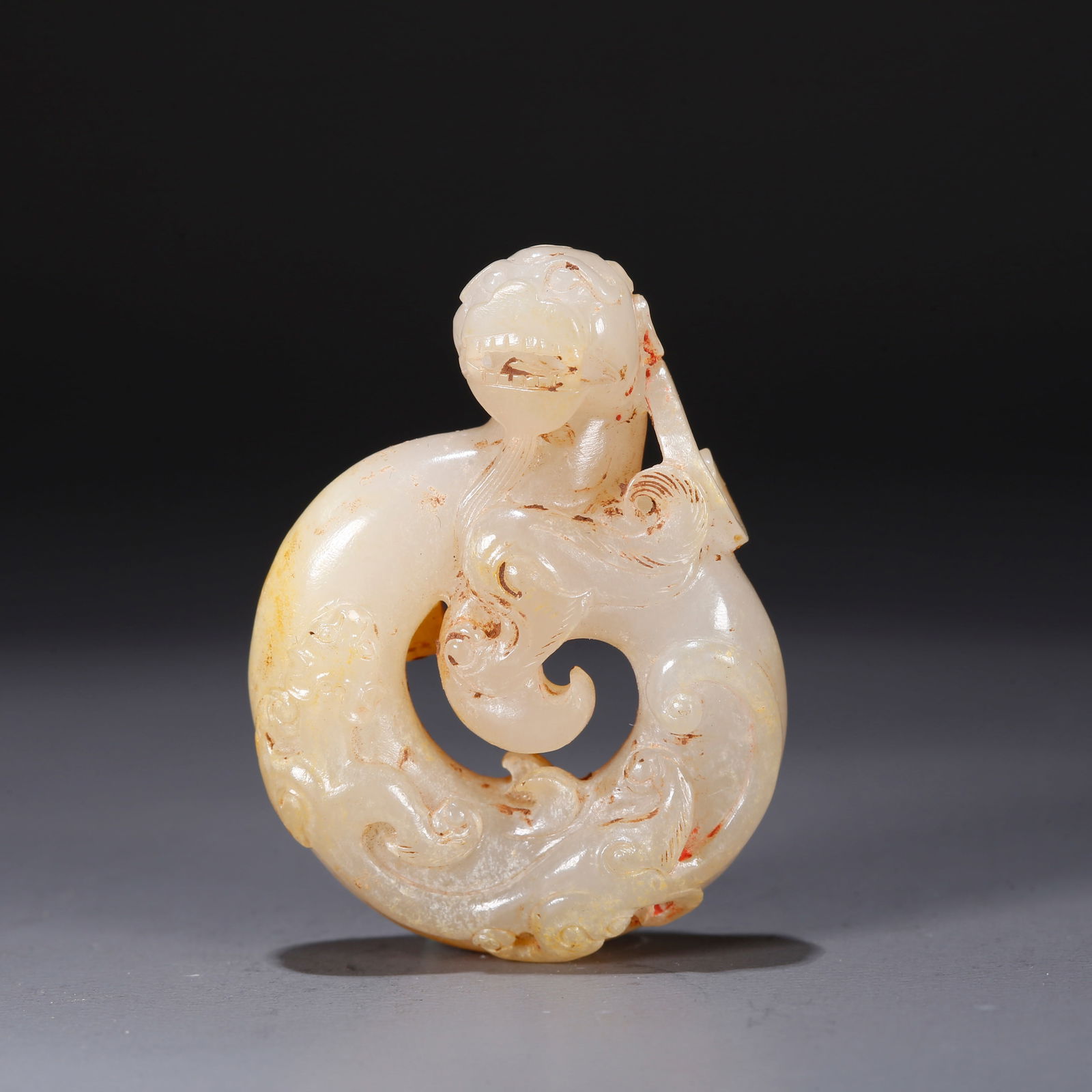 A HETIAN JADE CARVING OF A CHI DRAGON-SHAPED PENDANT (1 of 9)