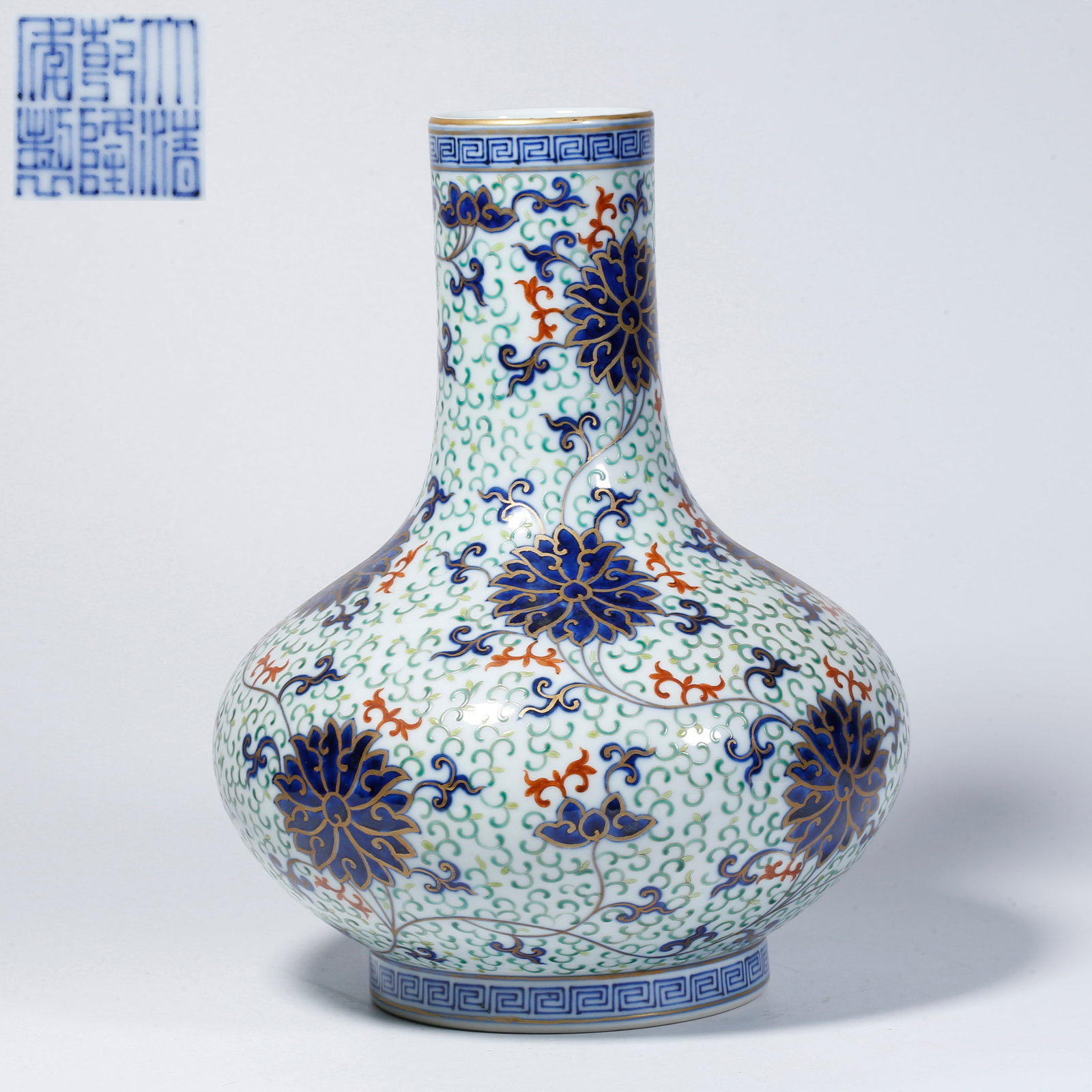 A FAMILLE-ROSE VASE WITH ENTWINED FLORAL SCROLL DESIGN: Famille-rose vase with entwined floral scroll design