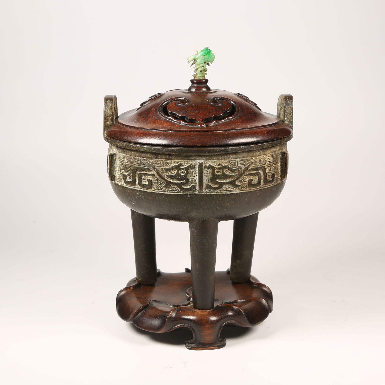 A BRONZE CENSER WITH AUSPICIOUS BEAST MOTIFS AND UPRIGHT FINIALS, THREE LEGS (1 of 10)