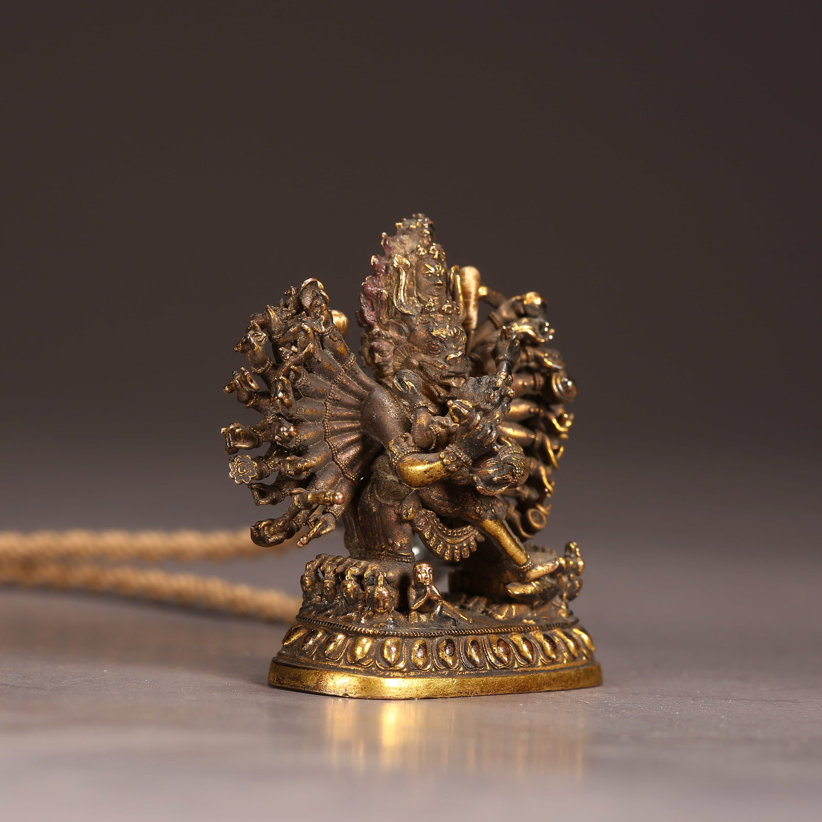 A GILT BRONZE SMALL SEATED MAHAVIRA VAJRA STATUE: Gilt Bronze Small Seated Mahavira Vajra Statue