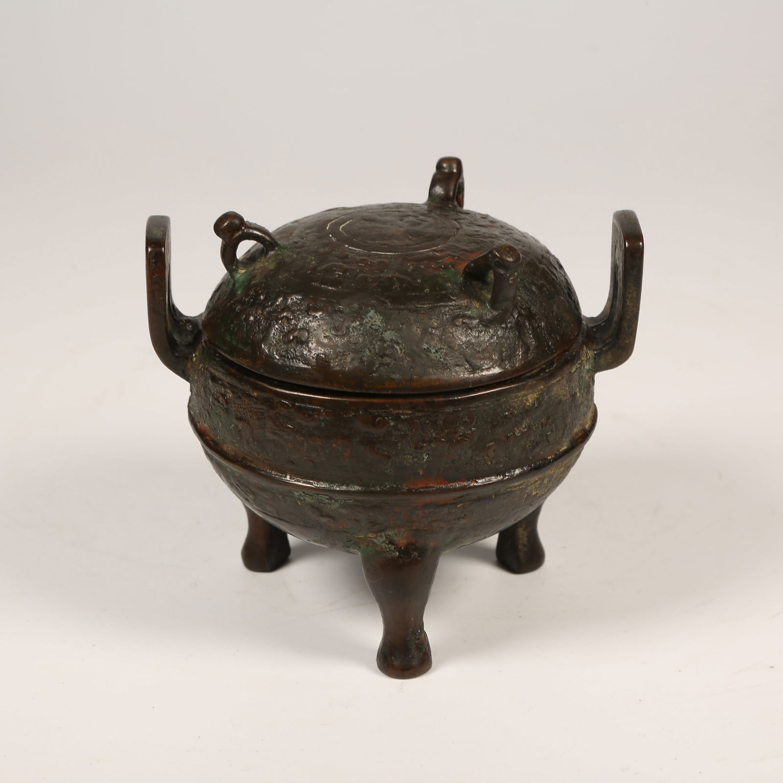 A BRONZE CENSER WITH THREE LEGS, THREE-SECTION HANDLES, AND CROWN-SHAPED EAR (1 of 8)