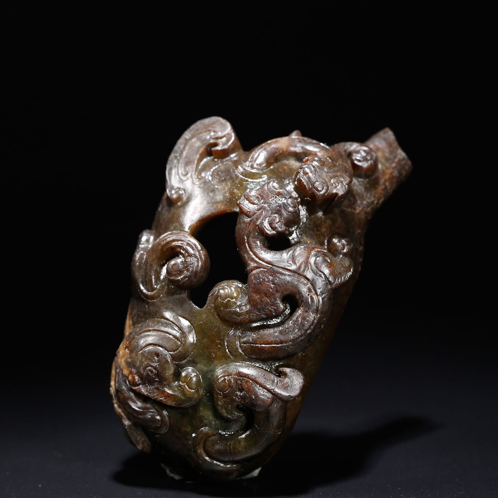 AN ARCHAIC JADE ARCHERY THUMB RING WITH CHI-DRAGON MOTIF: Archaic Jade Archery Thumb Ring with Chi-Dragon Motif