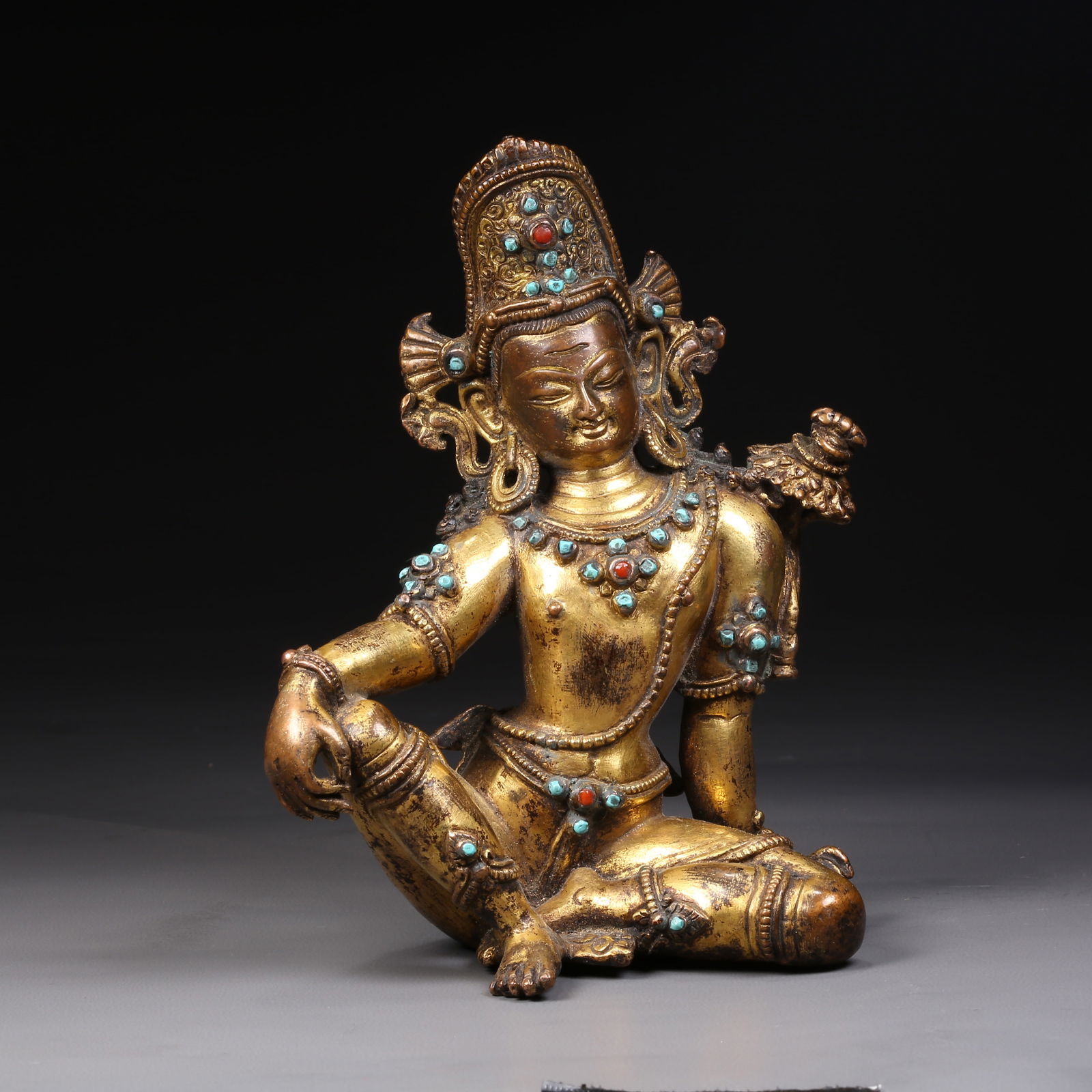 A GILDED BRONZE INDRA STATUE INLAID WITH TURQUOISE: Gilded bronze Indra statue inlaid with turquoise
