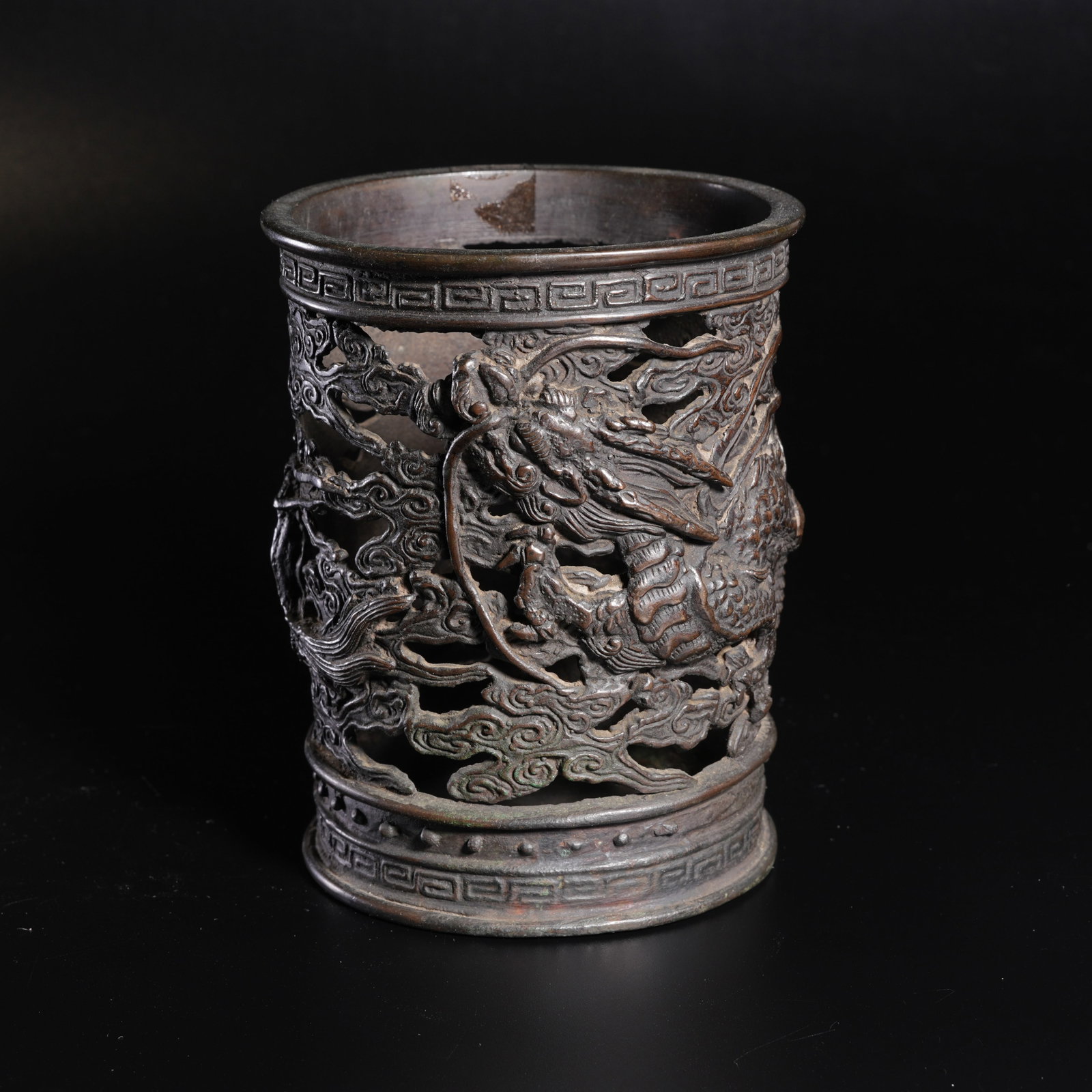 A BRONZE OPENWORK CLOUD AND DRAGON-PATTERN BRUSH HOLDER: Bronze Openwork Cloud and Dragon-Pattern Brush Holder