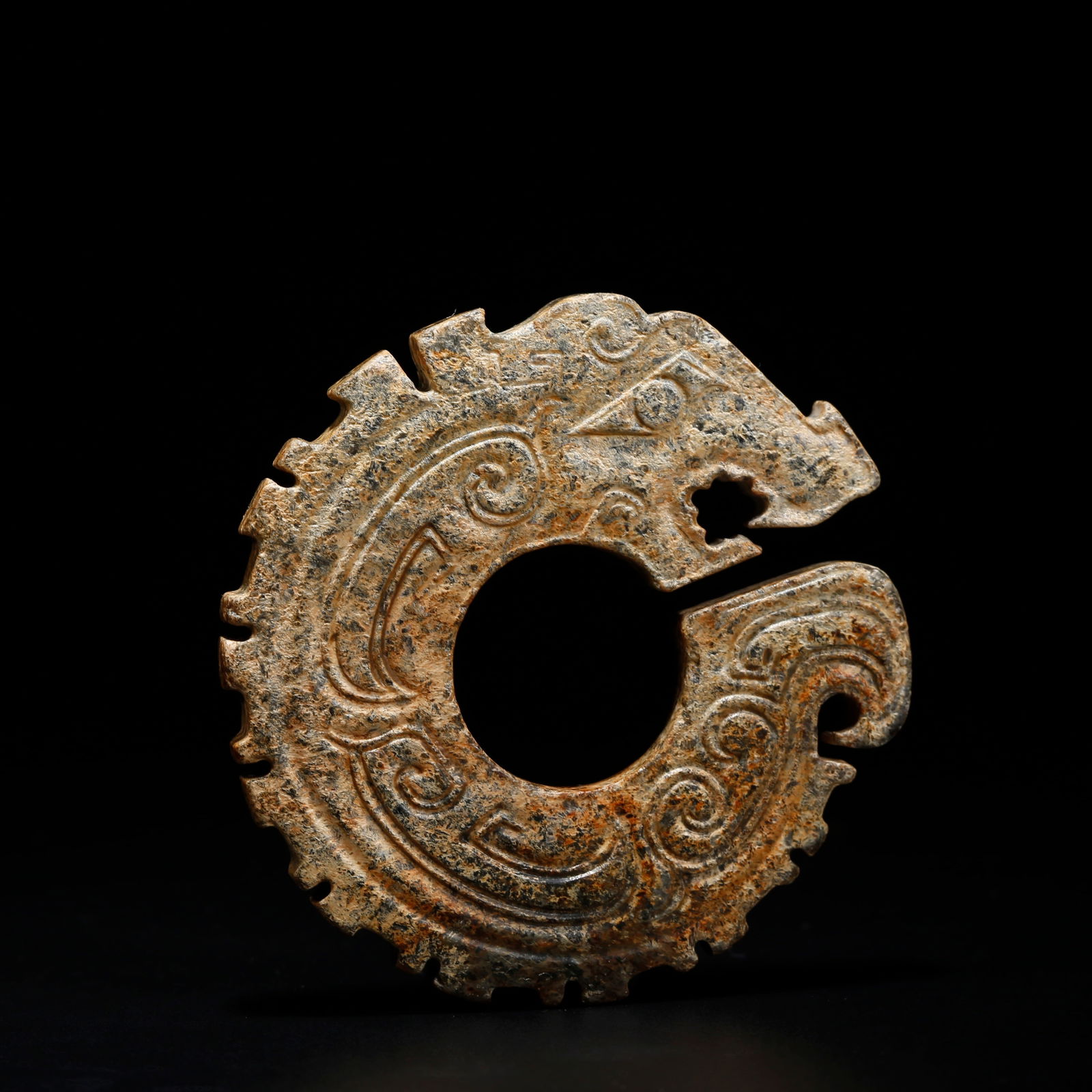 AN ARCHAIC JADE DRAGON RING BITING ITS TAIL: Archaic Jade Dragon Ring Biting Its Tail