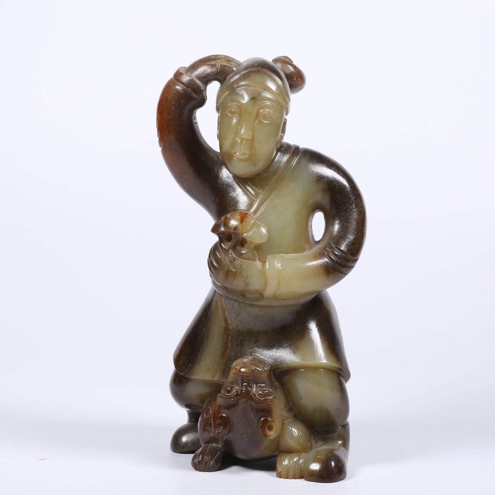 A ARCHAIC JADE HU (CENTRAL ASIAN) PLAYING WITH BEAST FIGURINE: Archaic Jade Hu (Central Asian) Playing with Beast Figurine