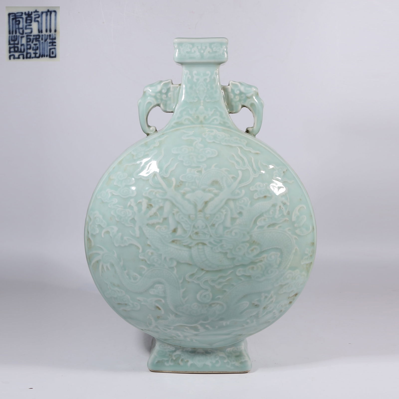 A SKY-BLUE GLAZE MOON FLASK WITH ELEPHANT-HEAD HANDLES AND CLOUD-AND-DRAGON MOTIFS: Sky-Blue Glaze Moon Flask with Elephant-Head Handles and Cloud-and-Dragon Motifs