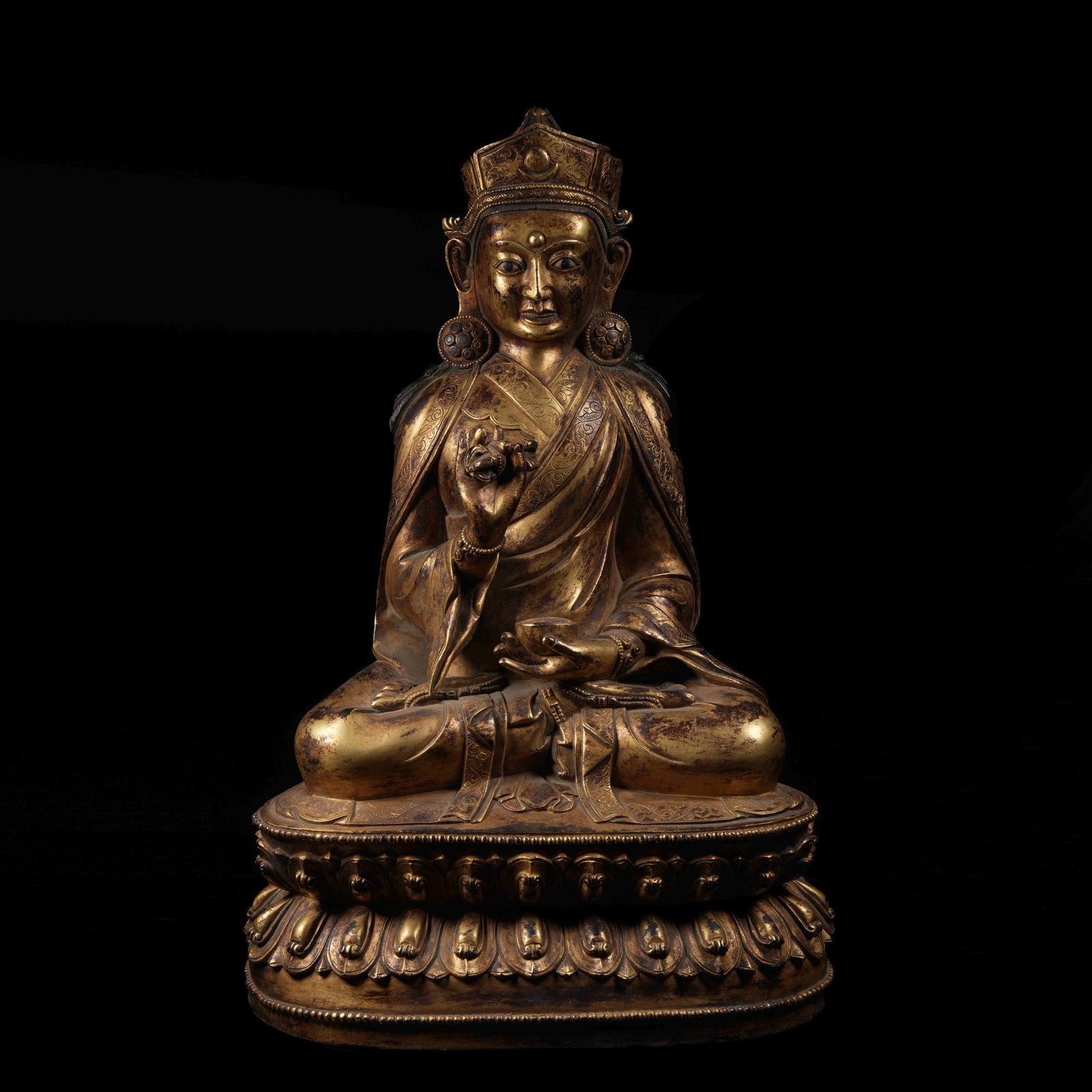 A GILT-BRONZE GURU PADMASAMBHAVA STATUE: Gilt-Bronze Guru Padmasambhava Statue