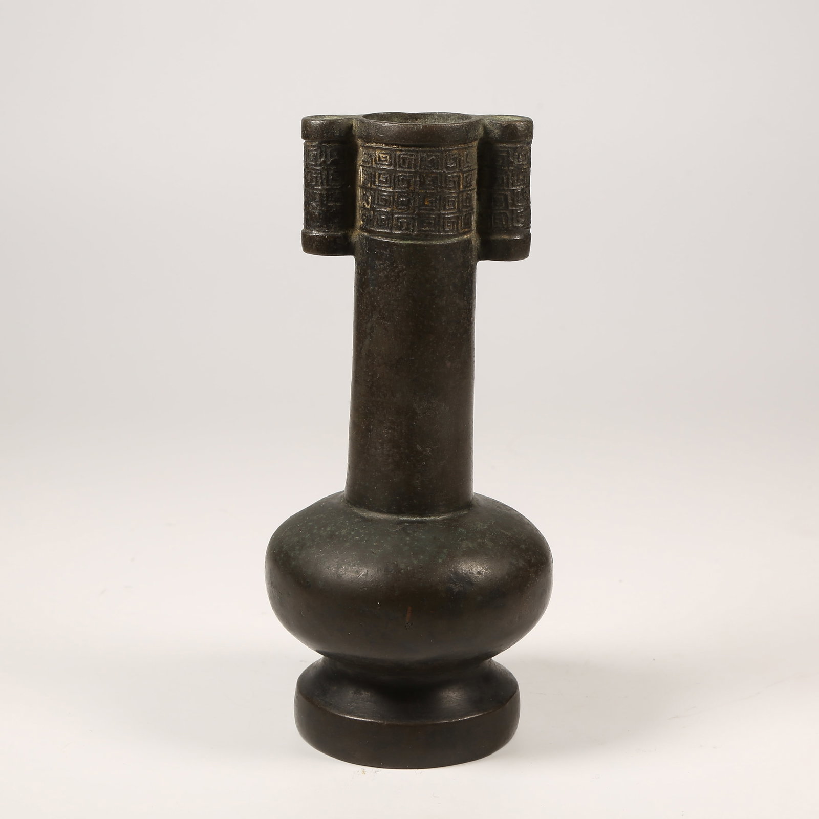 A BRONZE VASE WITH ANIMAL-FORM HANDLES: Bronze Vase with Animal-Form Handles