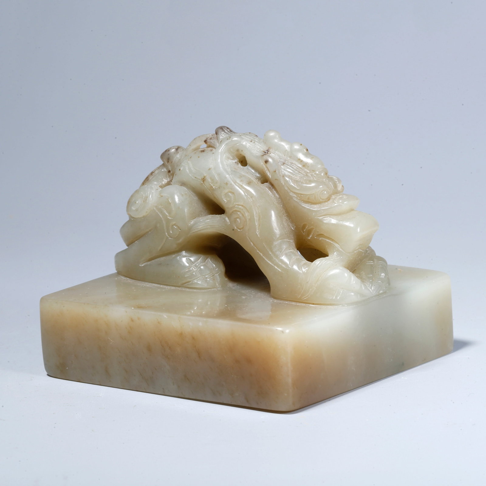 A HETIAN JADE SEAL WITH RECLINING DRAGON KNOB (1 of 9)